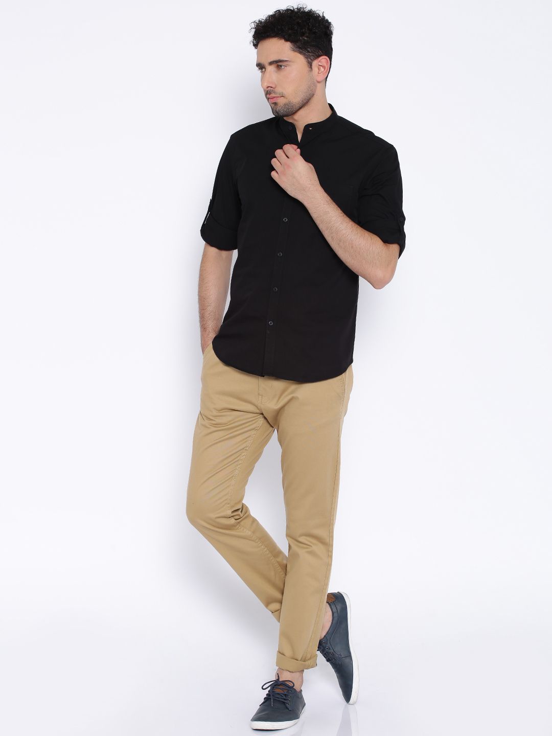 khaki shirt with black pants