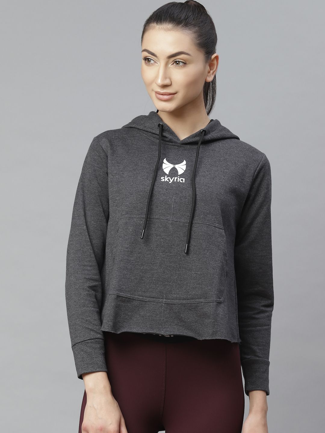 skyria Women Charcoal Grey Solid Styled Back Hooded Cropped Sweatshirt Price in India