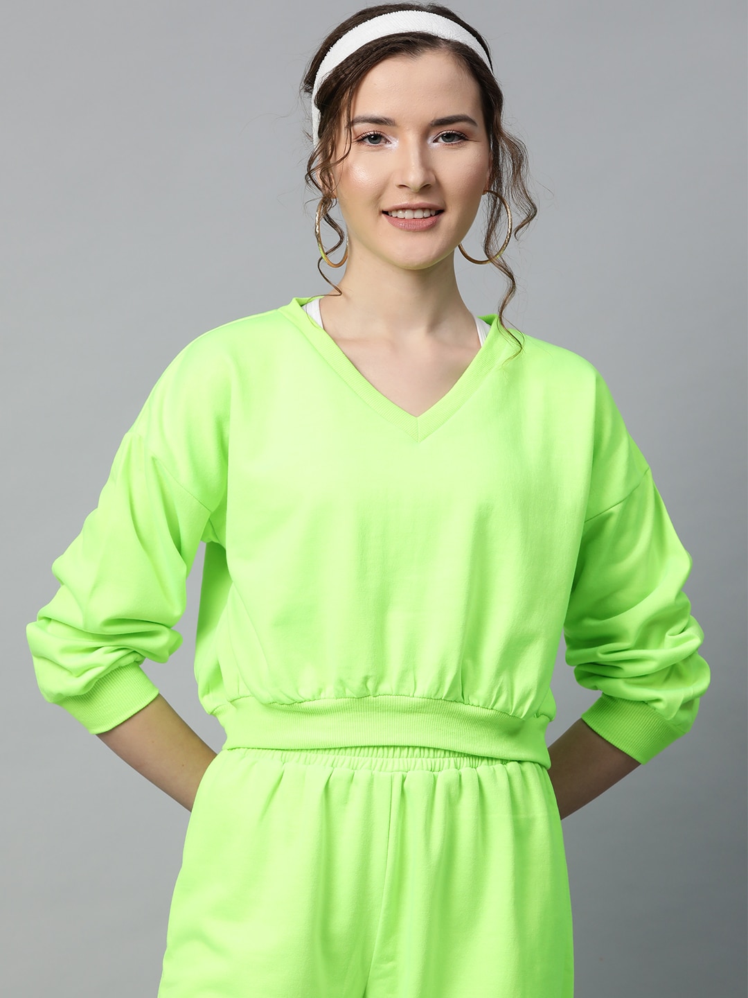 SASSAFRAS Women Fluorescent Green Solid Sweatshirt Price in India