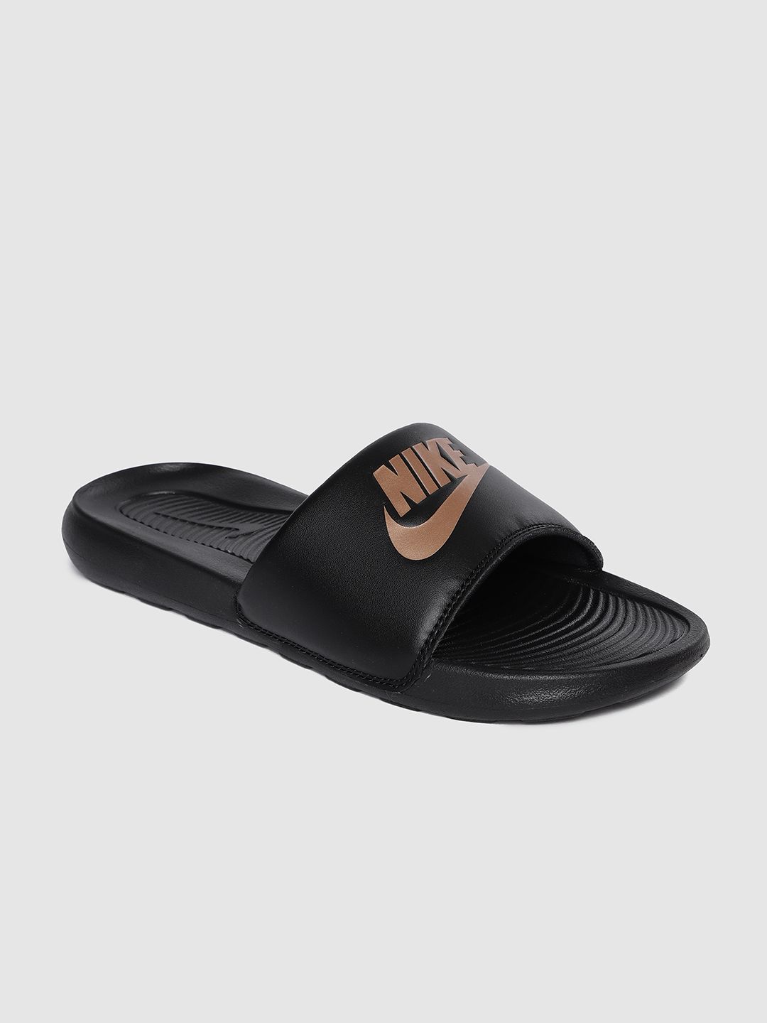 nike sliders with gold tick