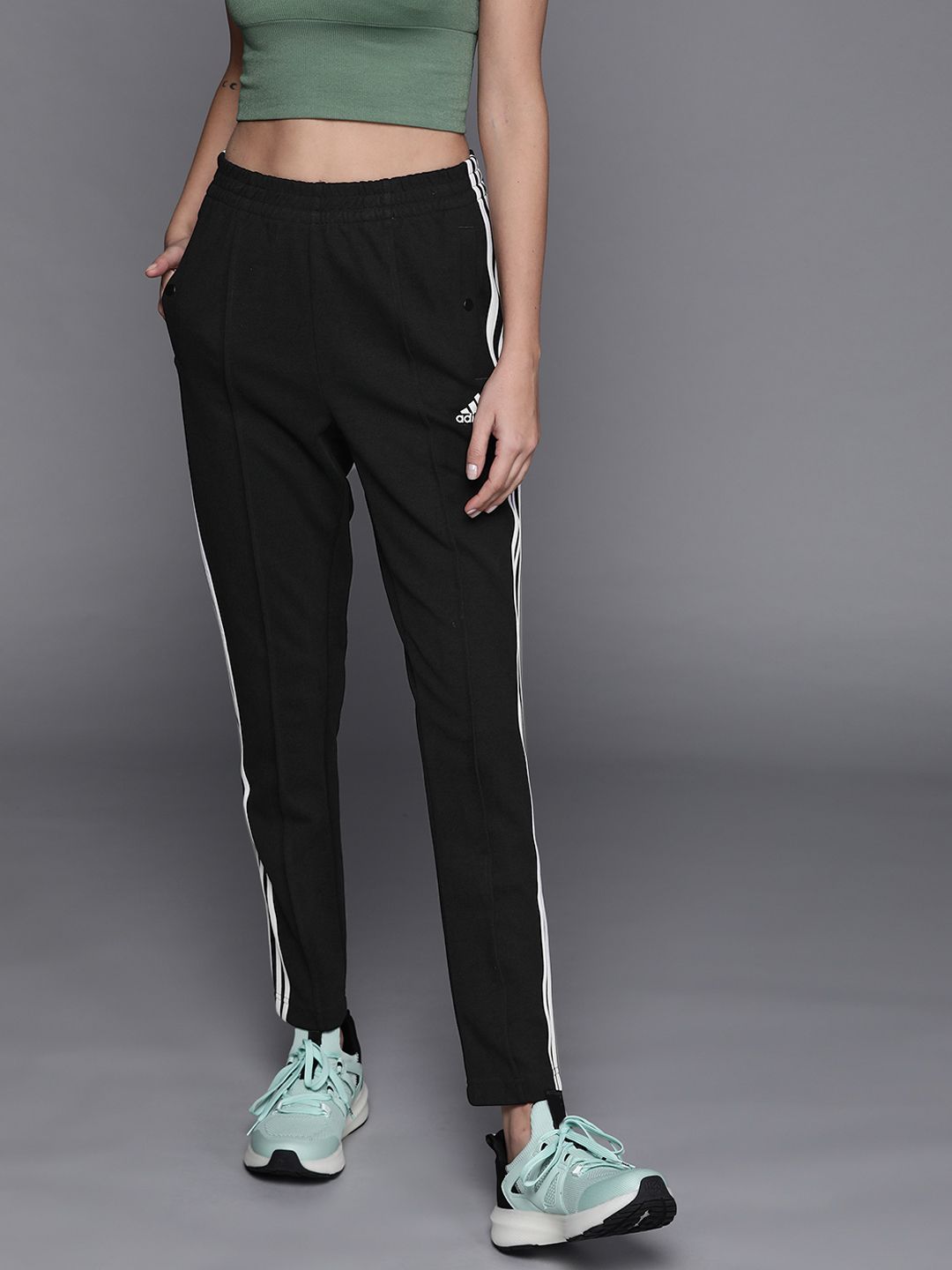 ADIDAS Women Black Solid Slim Fit Sustainable Snap Pants with Side Stripes Price in India