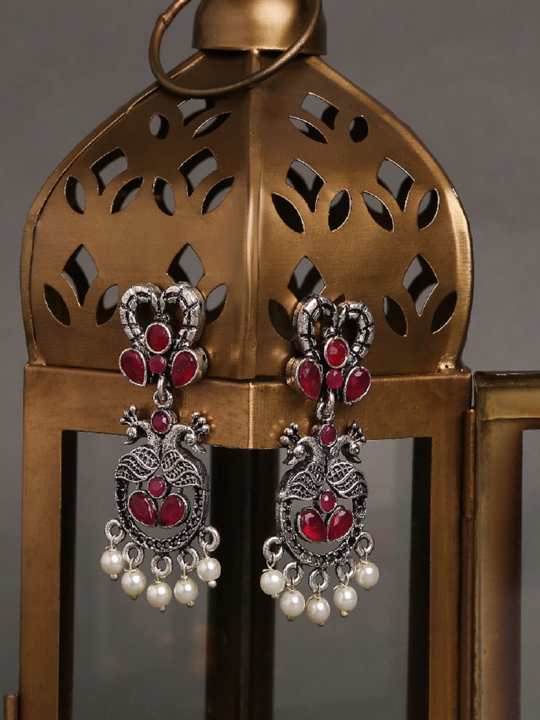 OOMPH Silver-Toned & Maroon Peacock Shaped Chandbalis Price in India
