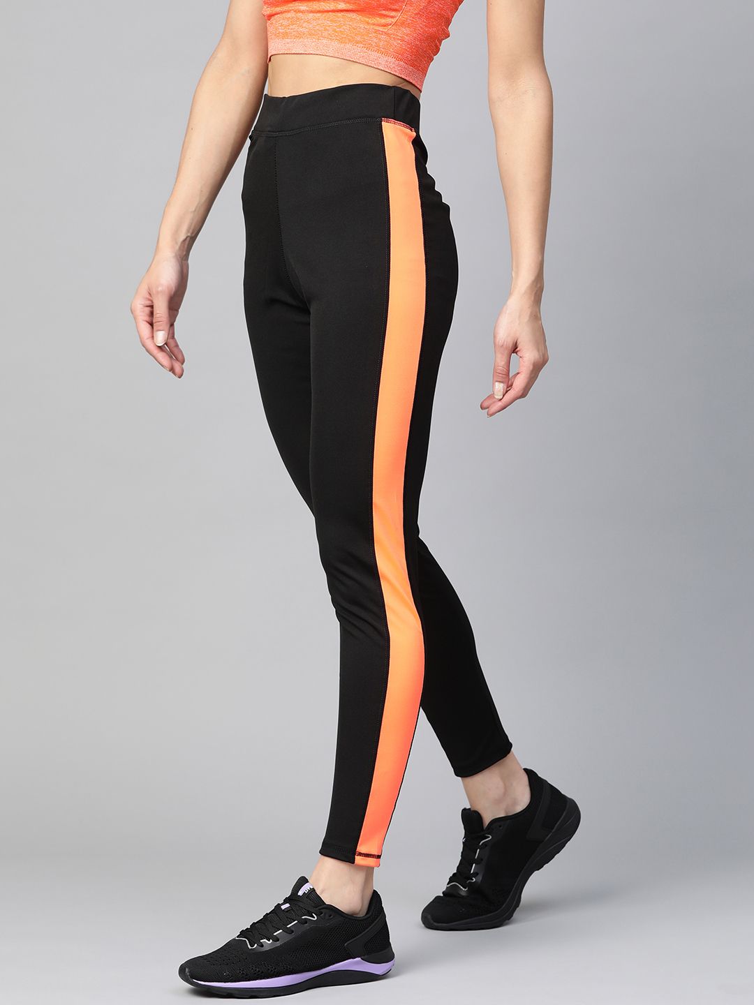 M7 by Metronaut Women Black & Neon Orange High-Rise Solid Training Tights Price in India