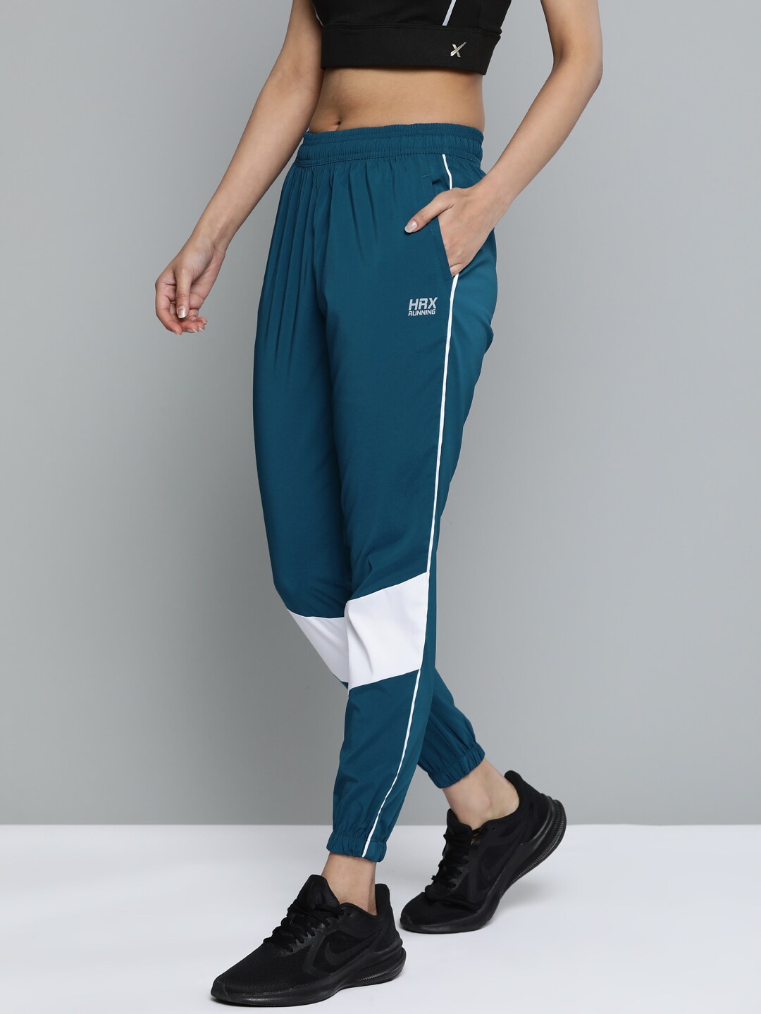 HRX By Hrithik Roshan Women Teal Blue Colourblock Rapid-Dry Antimicrobial Running Joggers Price in India