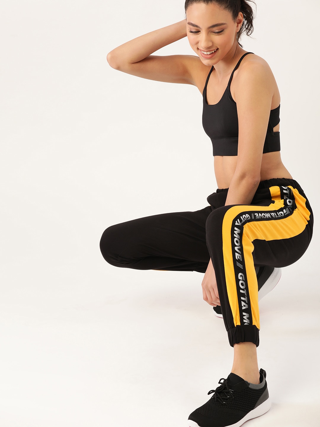 DressBerry Women Black & Yellow Solid Regular Fit Cropped Joggers Price in India