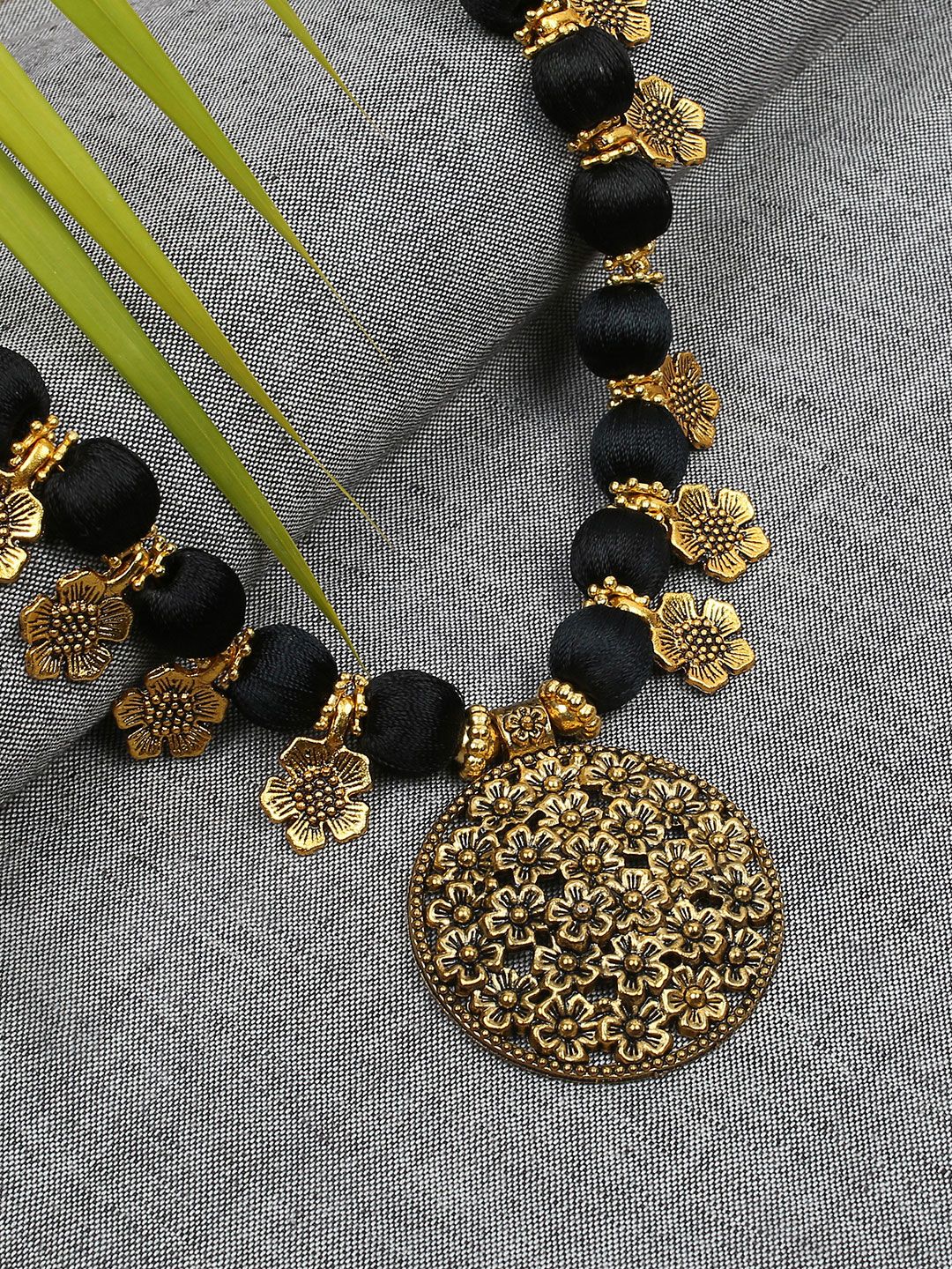 AKSHARA Black & Gold-Toned Statement Handcrafted Brass Necklace Price in India