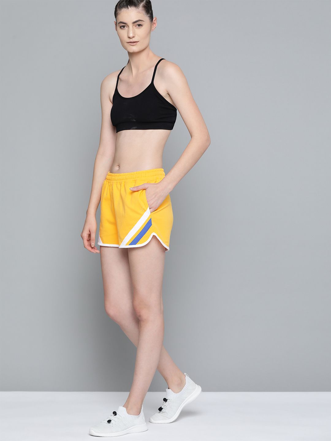 HRX By Hrithik Roshan Women Aspen Gold Colourblock Regular Fit Mid-Rise Bio-Wash Lifestyle Shorts Price in India