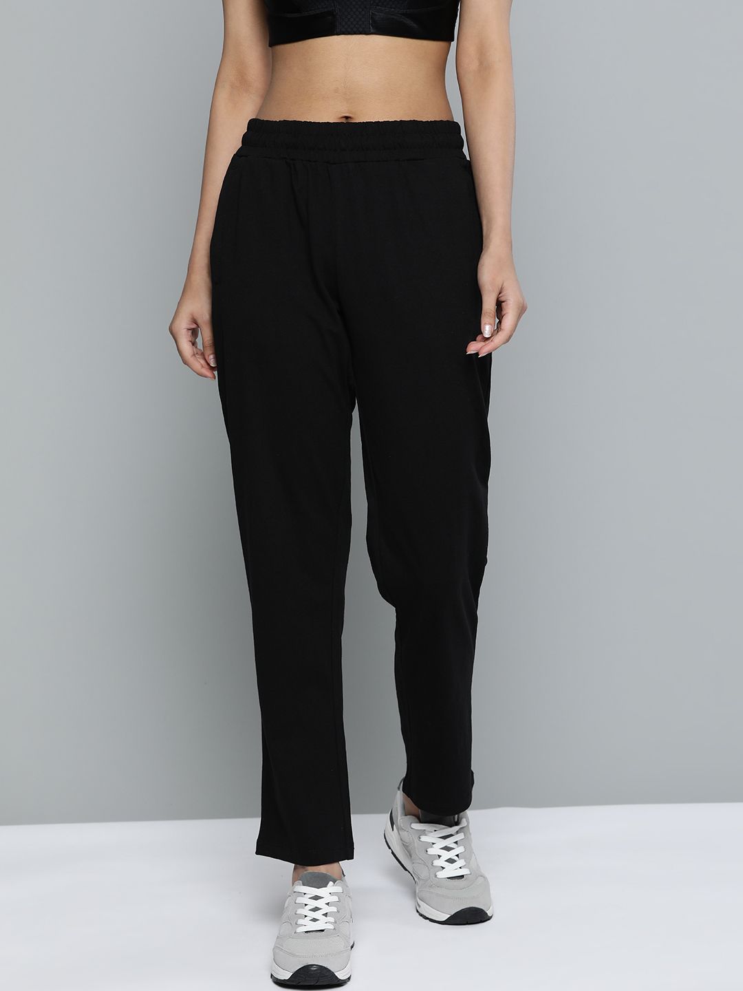 Alcis Women Black Solid Straight Fit Track Pants Price in India