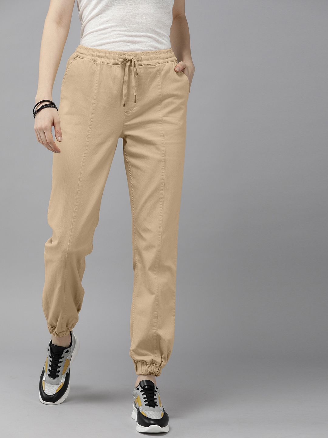 The Roadster Lifestyle Co Women Cream-Coloured High-Rise Joggers Trousers Price in India