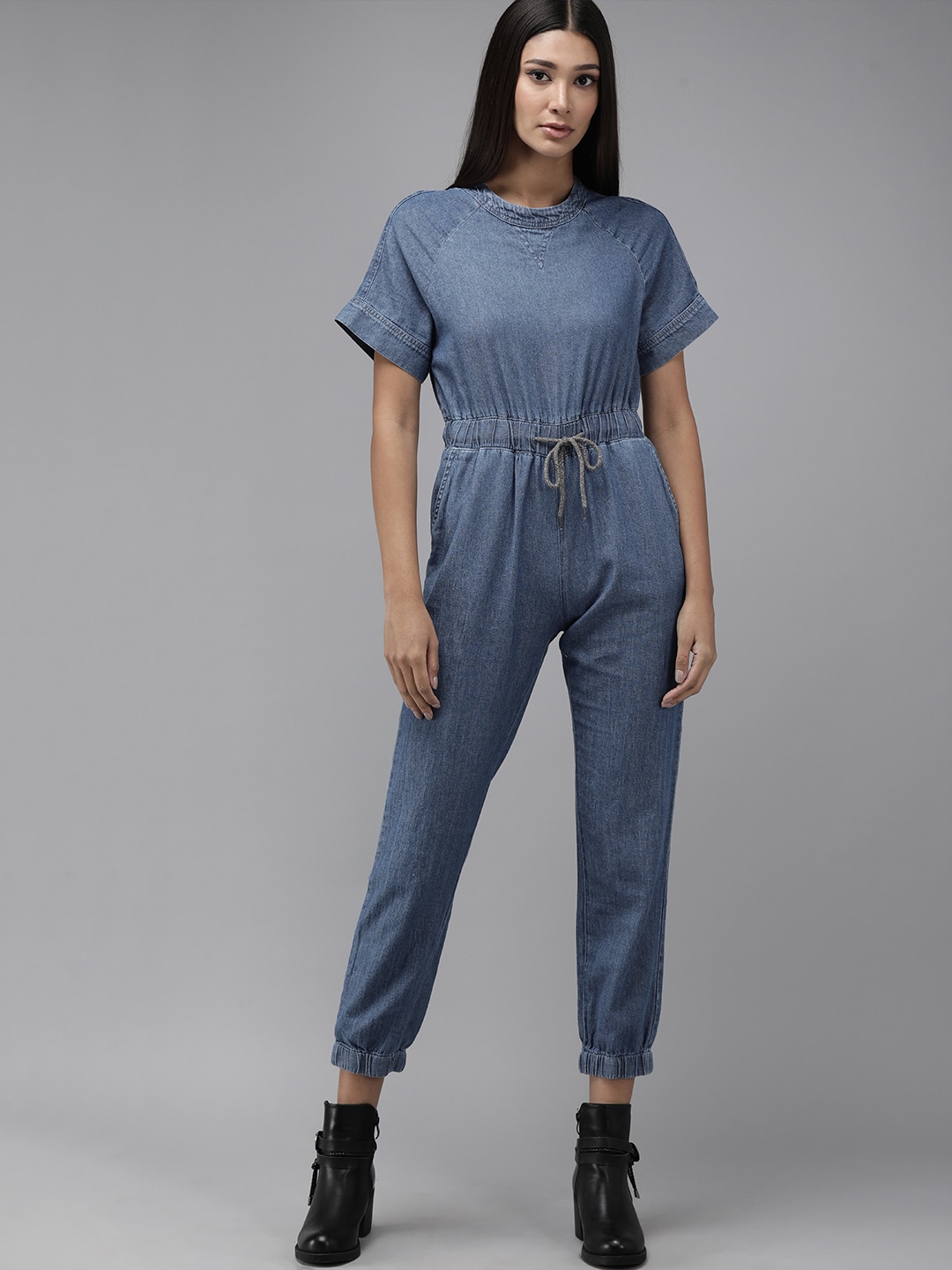 The Roadster Lifestyle Co Blue Jogger Fit Basic Denim Cropped Jumpsuit with Waist Tie-Ups Price in India