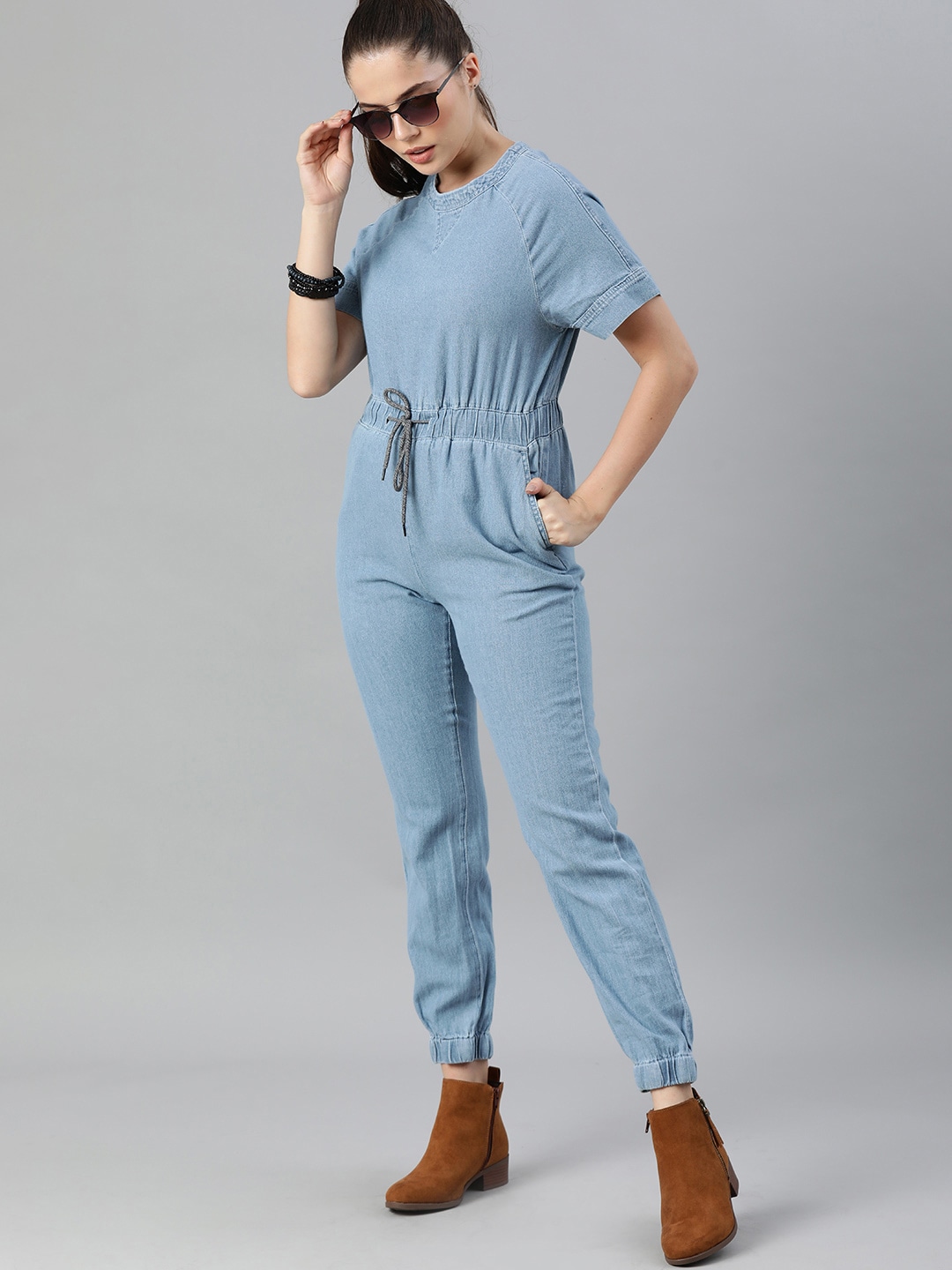 The Roadster Lifestyle Co Blue Solid Jogger Fit Basic Denim Jumpsuit Price in India