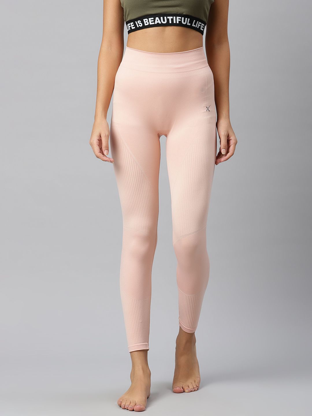 HRX By Hrithik Roshan Women Peach Whip Solid Skinny Fit Seamless Rapid-Dry Yoga Tights Price in India