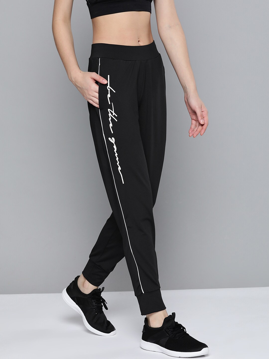 Alcis Women Black Slim Fit Solid Joggers with Typographic Detail Price in India