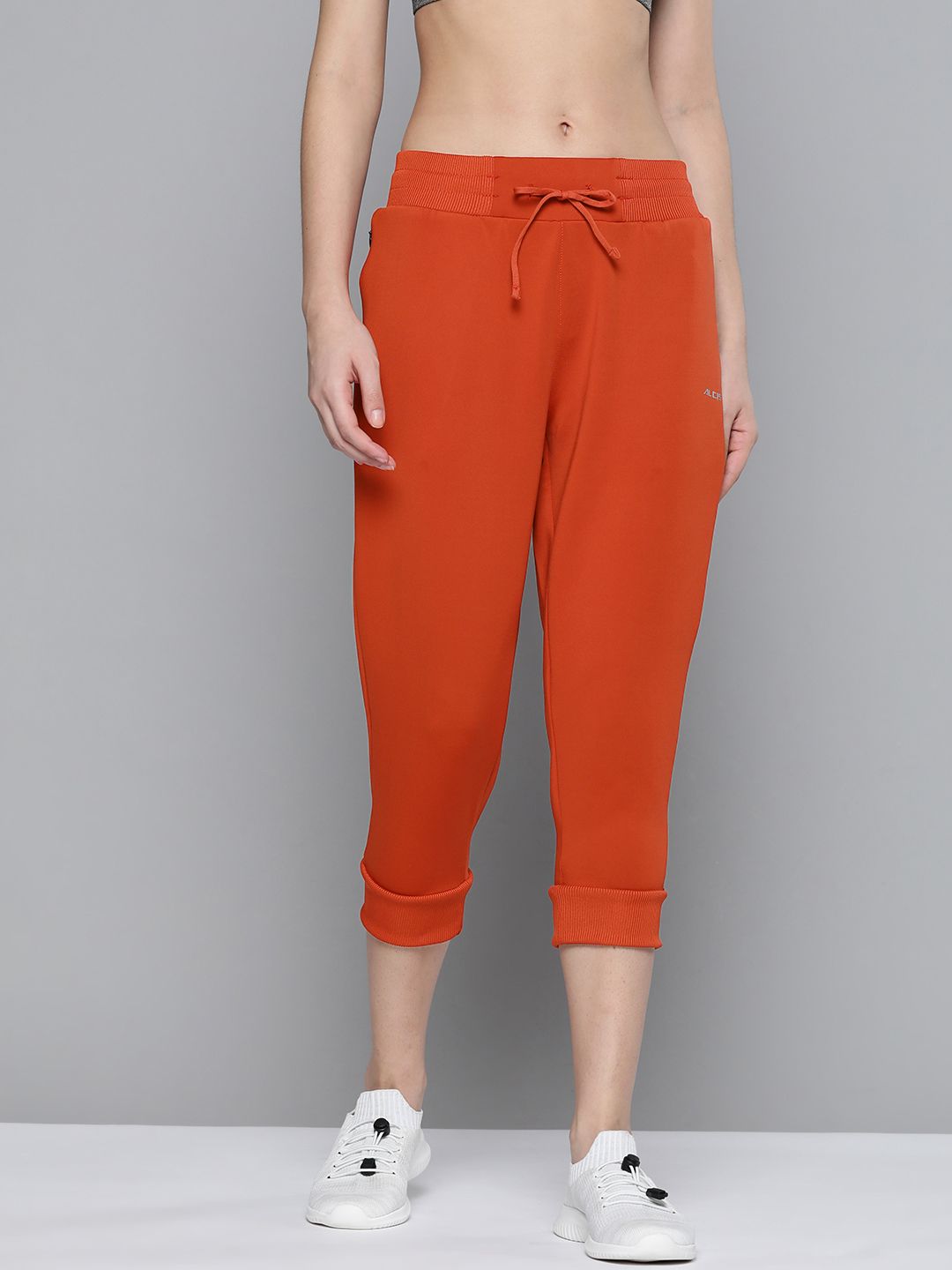 Alcis Women Rust Red Solid Knitted Cropped Joggers Price in India