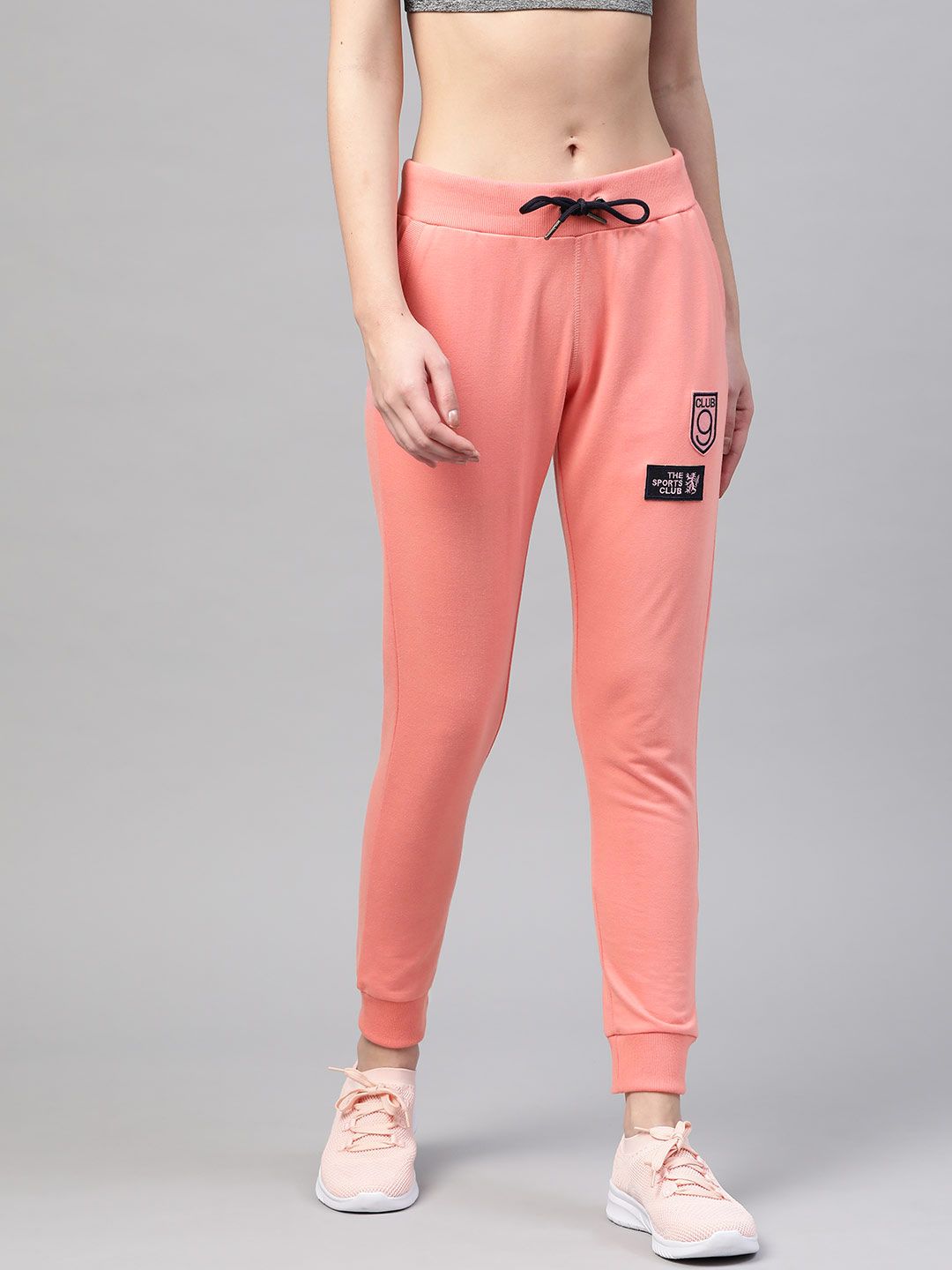 M7 by Metronaut Women Coral Pink Solid Cropped Joggers Price in India