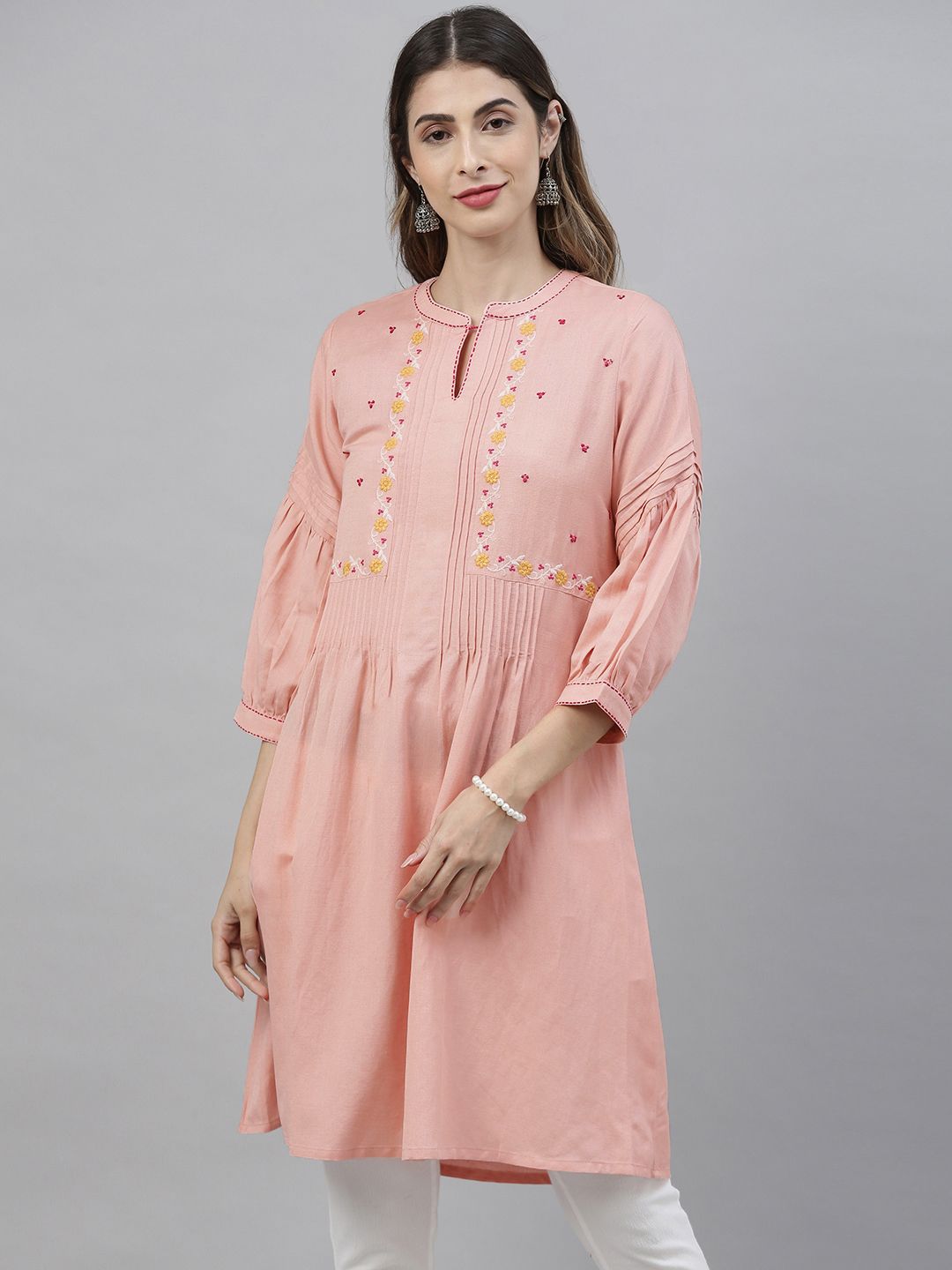 Global Desi Women's Pink & Yellow Solid Tunic Price in India