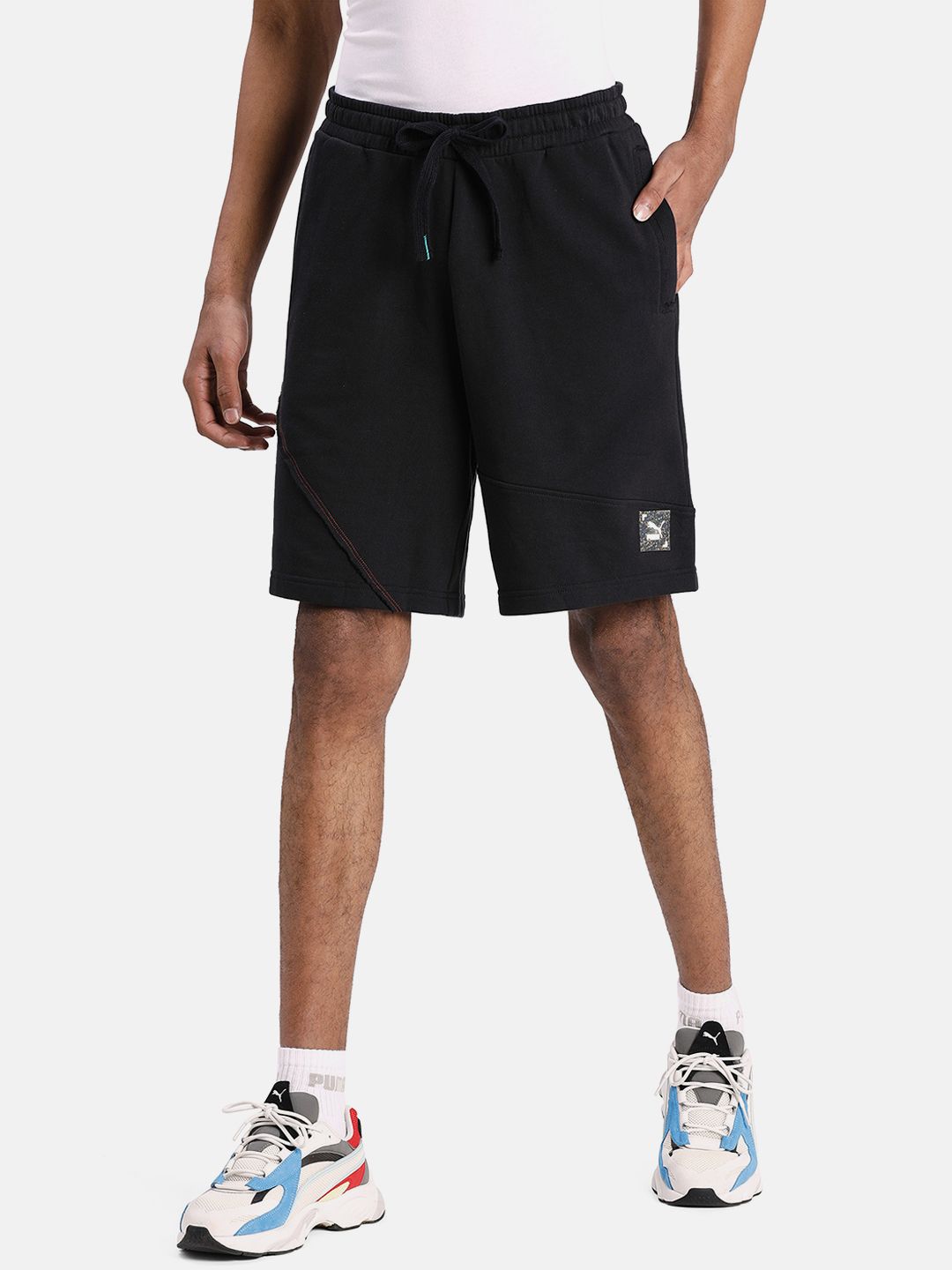 Puma Unisex Black Solid RE.GEN Regular Fit Shorts Price in India