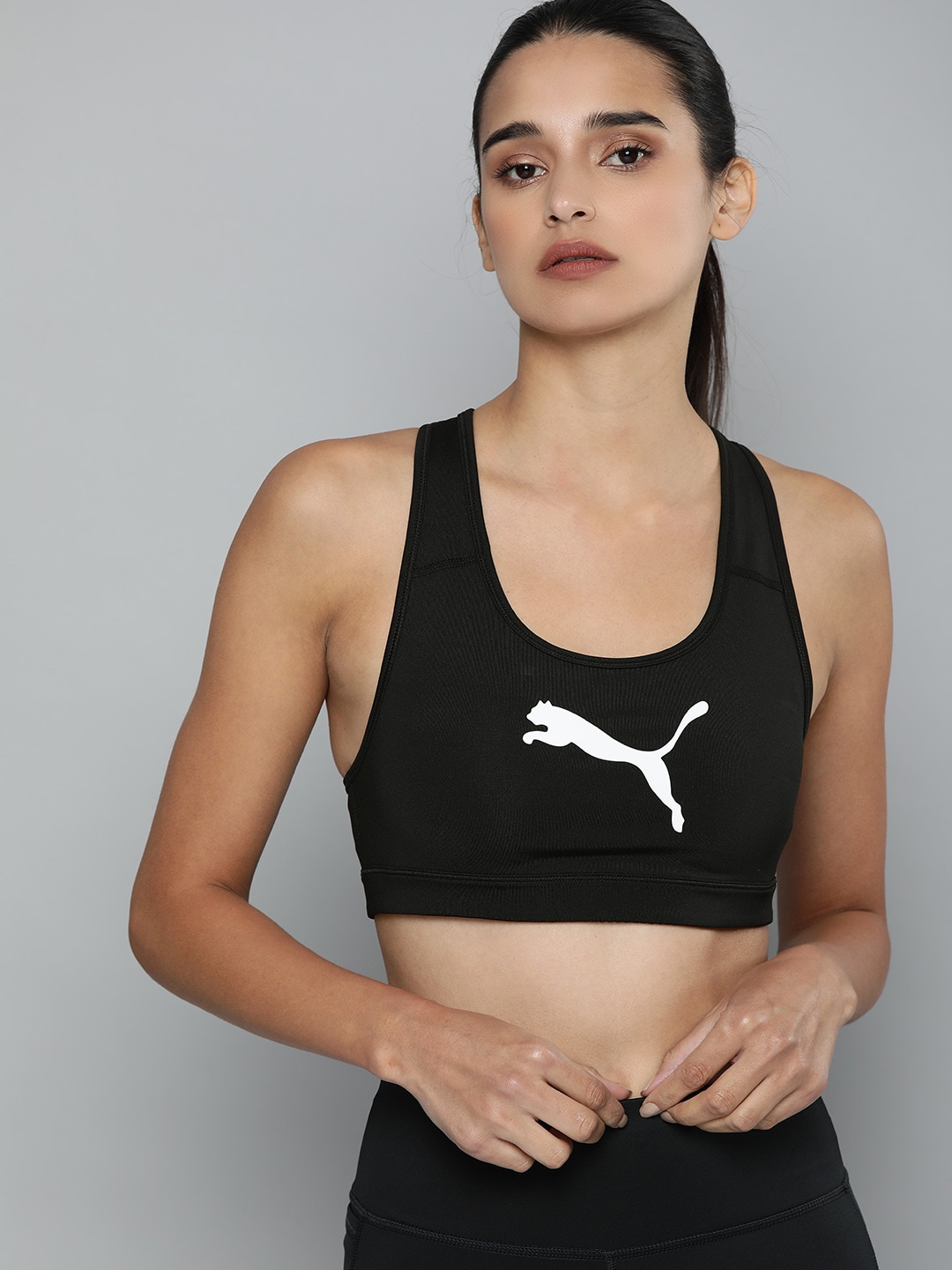 Puma Black Solid Non-Wired Lightly Padded Mid Impact 4Keeps Sports Bra Price in India