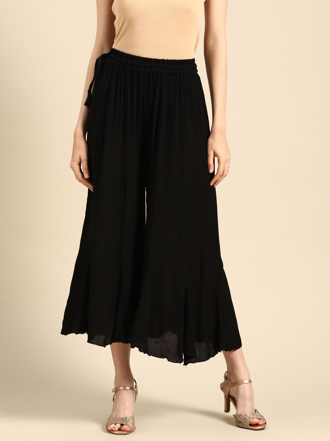 TAG 7 Women Black Solid Flared Cropped Palazzos Price in India