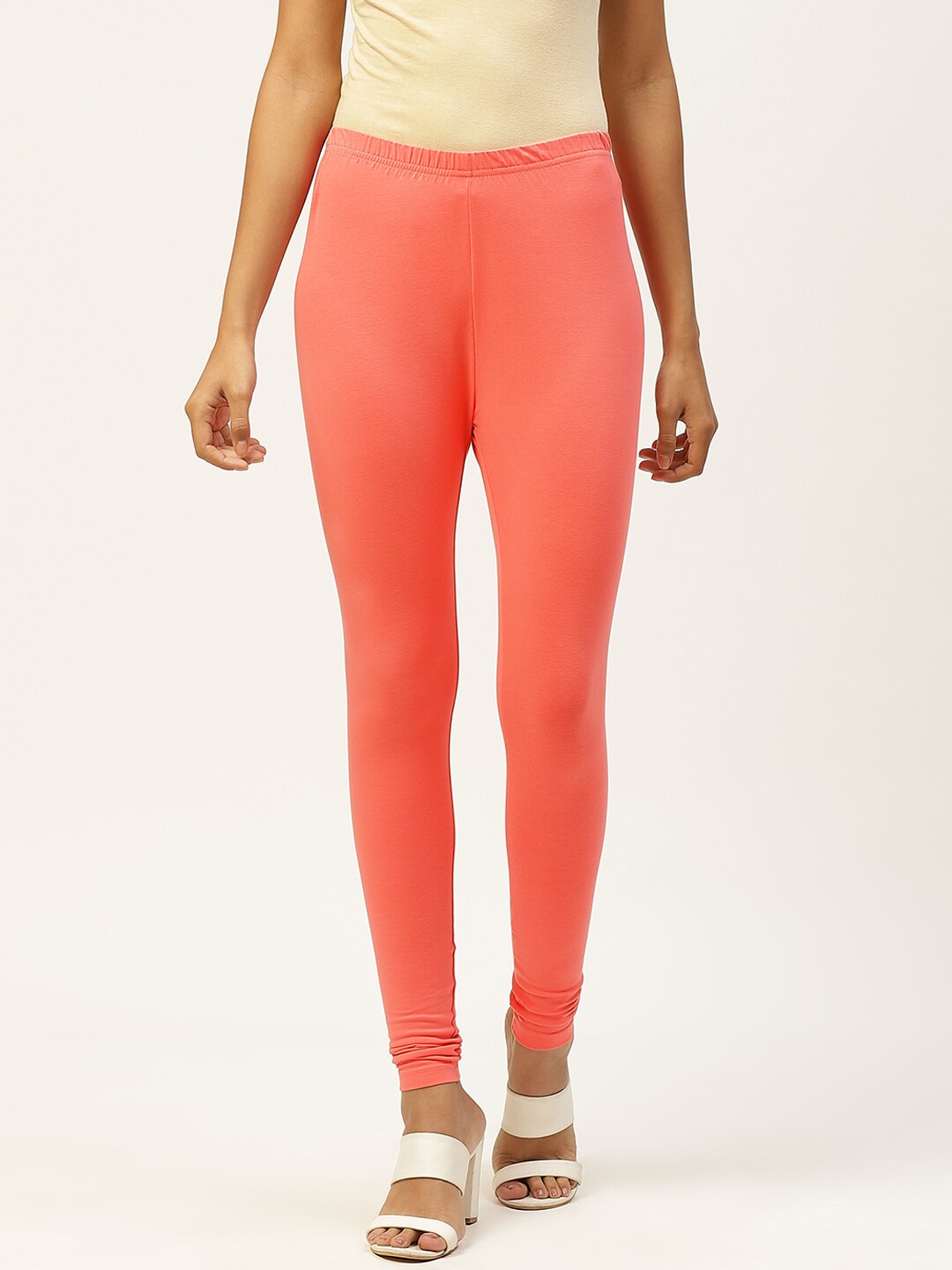 Monte Carlo Women Coral Orange Solid Knitted Pure Cotton Churidar Leggings Price in India