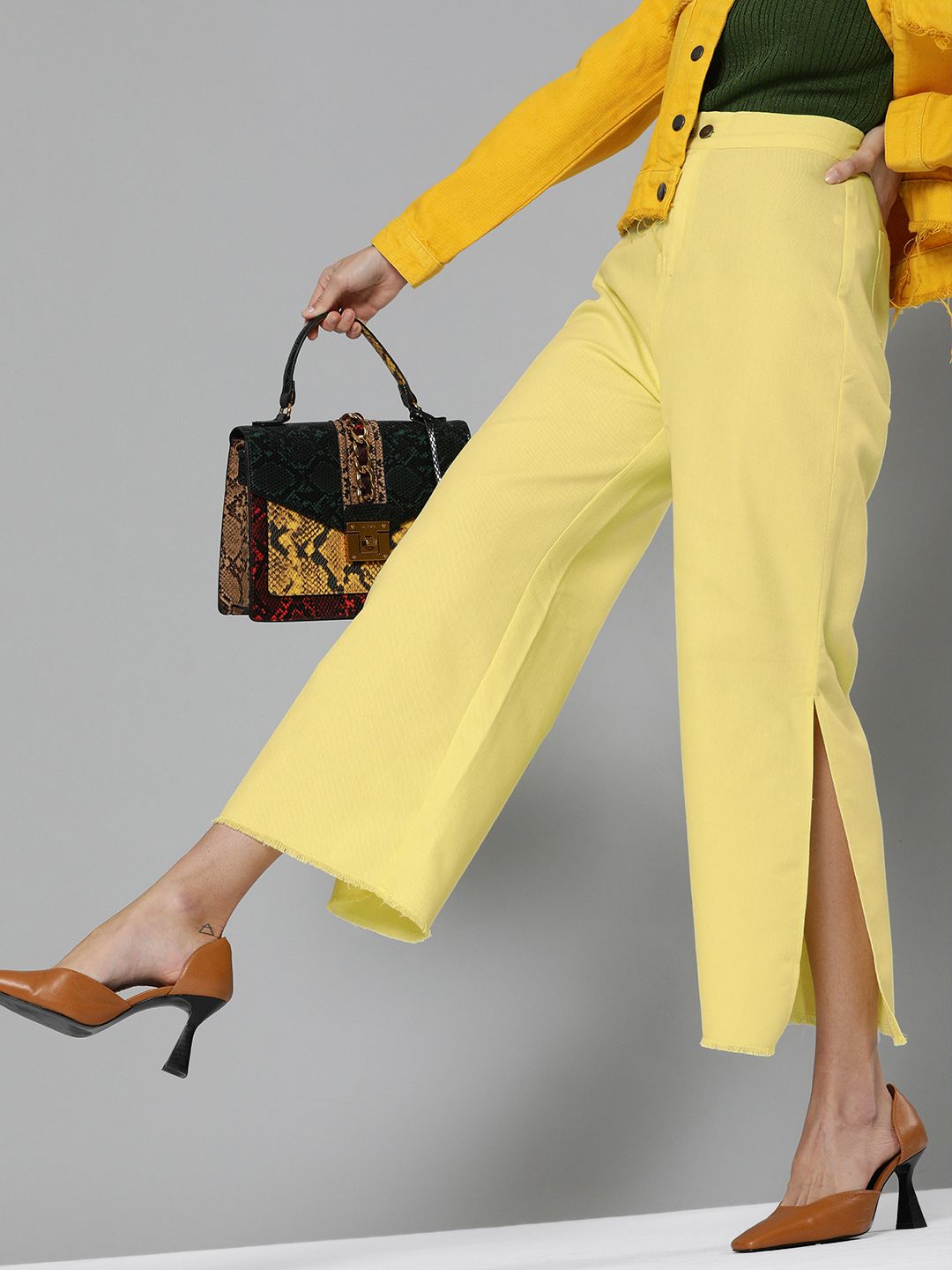 SASSAFRAS Women Yellow Regular Fit Solid Parallel Cropped Trousers with Side Slits Price in India