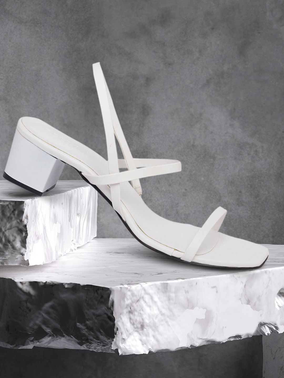 ERIDANI Women White Solid Block heels Price in India
