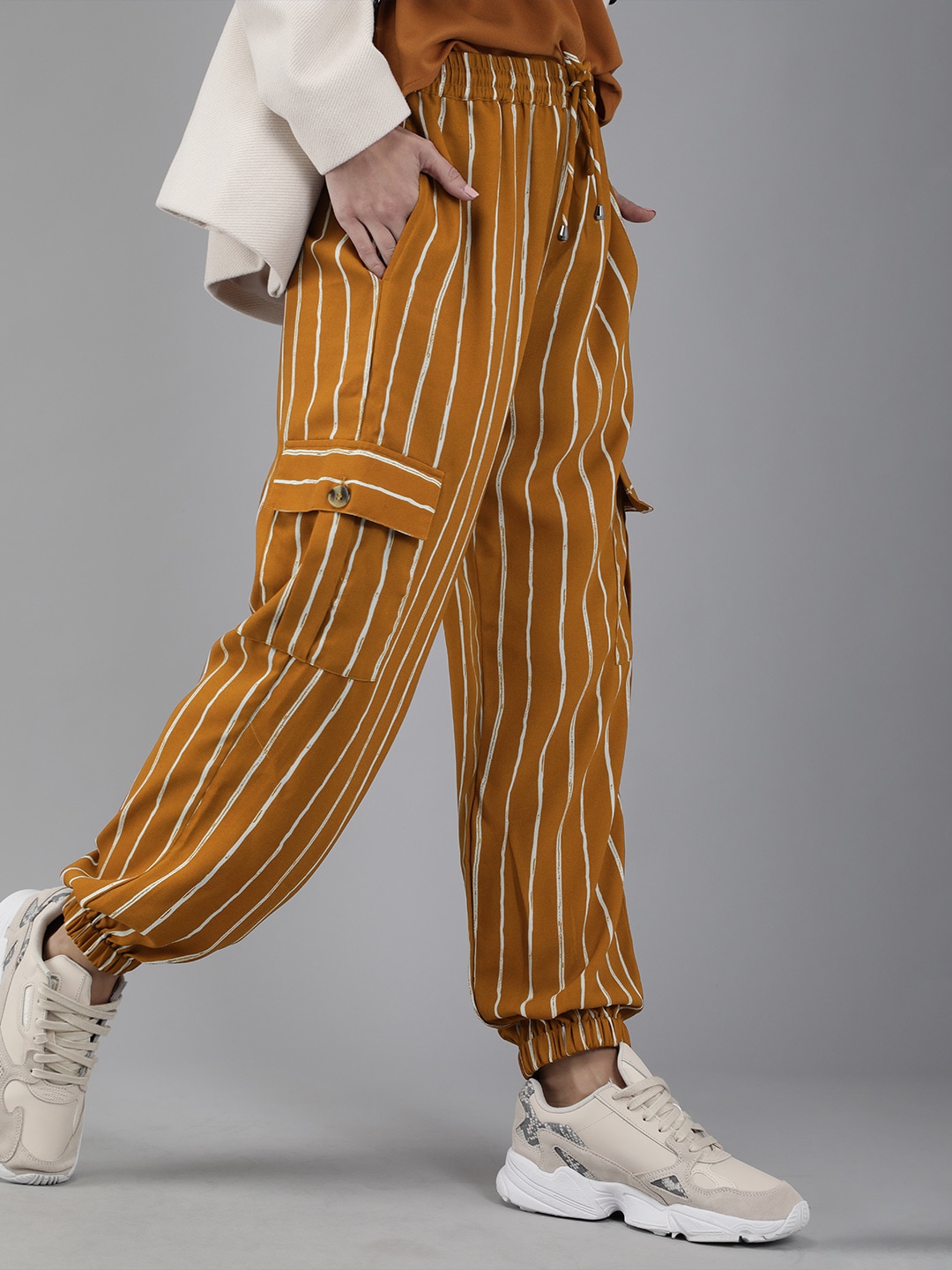 RARE Women Mustard Yellow & White Loose Fit Striped Joggers Price in India