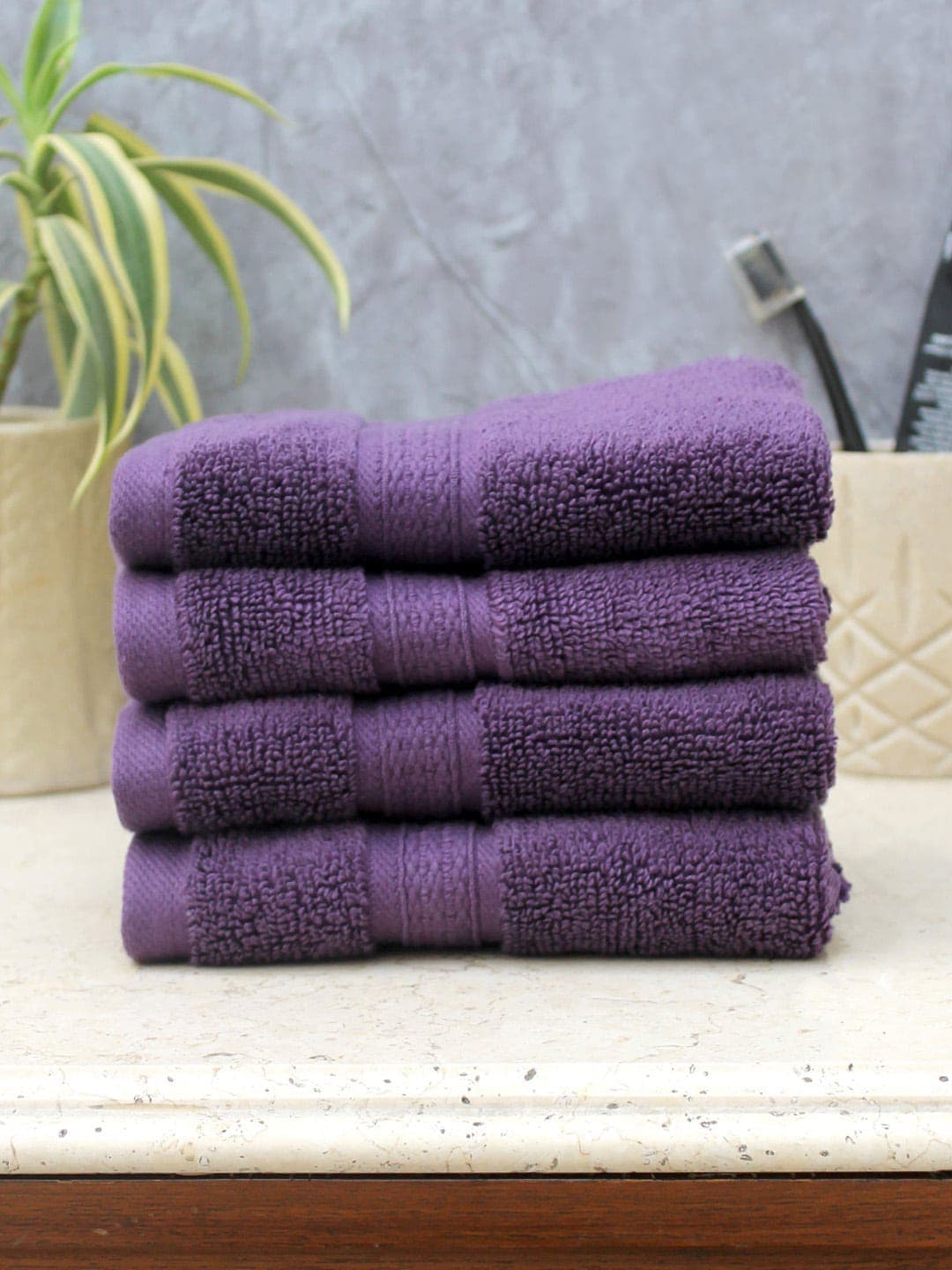 AVI Living Set of 4 Purple Solid 550 GSM Face Towels Price in India