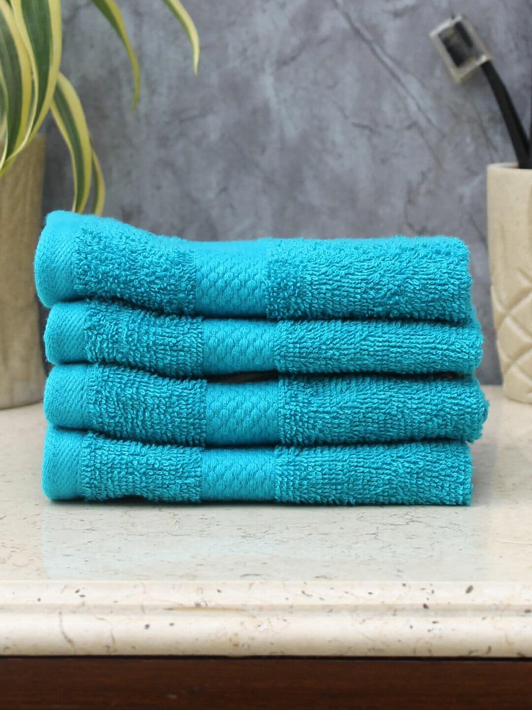 AVI Living Set of 4 Turquoise Blue Solid 550 GSM Face Towels Price in India