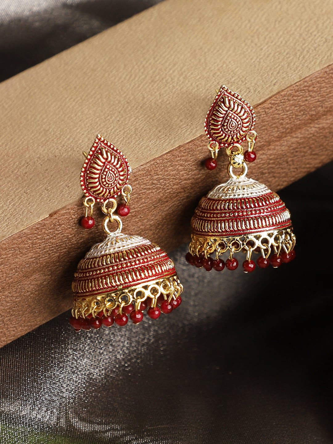 ANIKAS CREATION Maroon & Gold-Toned Dome Shaped Jhumkas Price in India