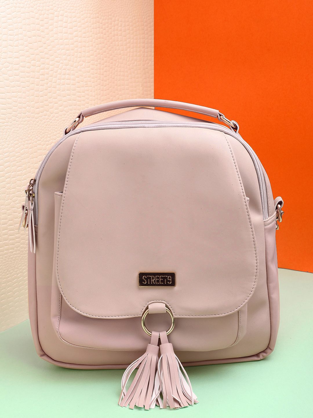 Street 9 Women Peach-coloured Tasselled Backpack Price in India