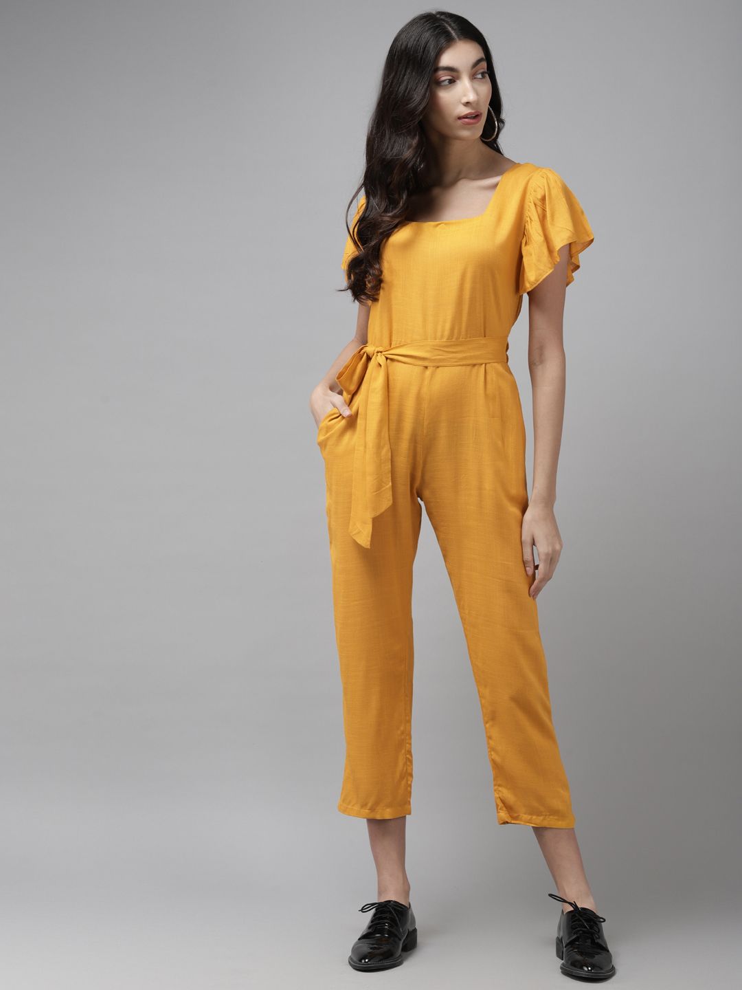 Cayman Women Mustard Yellow Solid Cropped Basic Jumpsuit With Belt Price in India