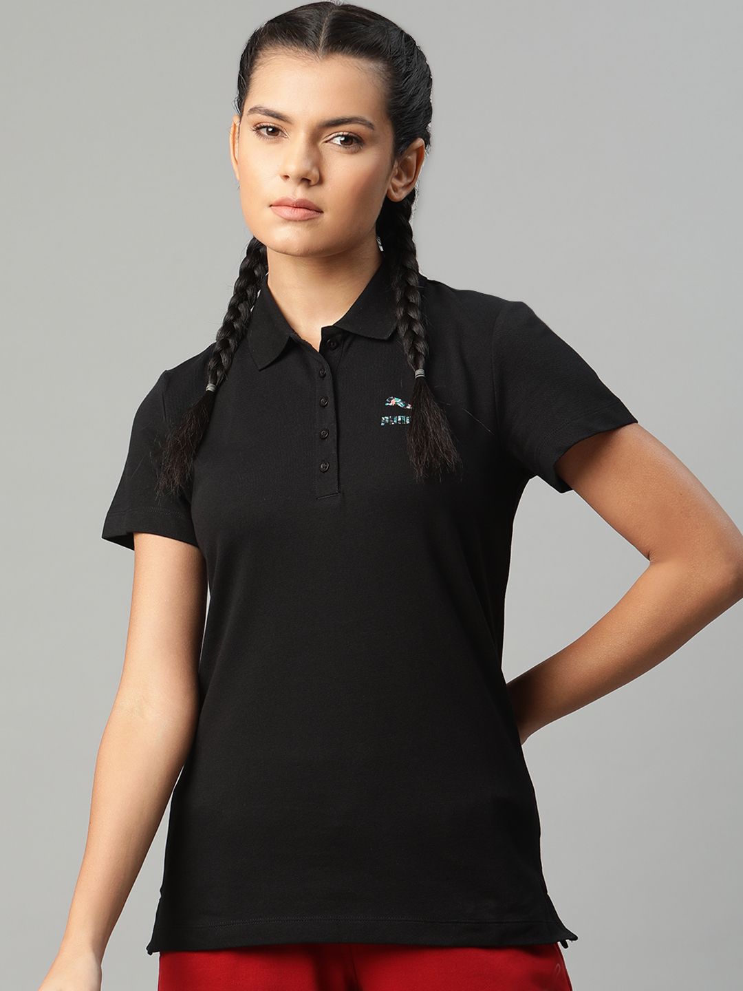 Puma Women Black Solid Polo 1 T-shirt Price in India
