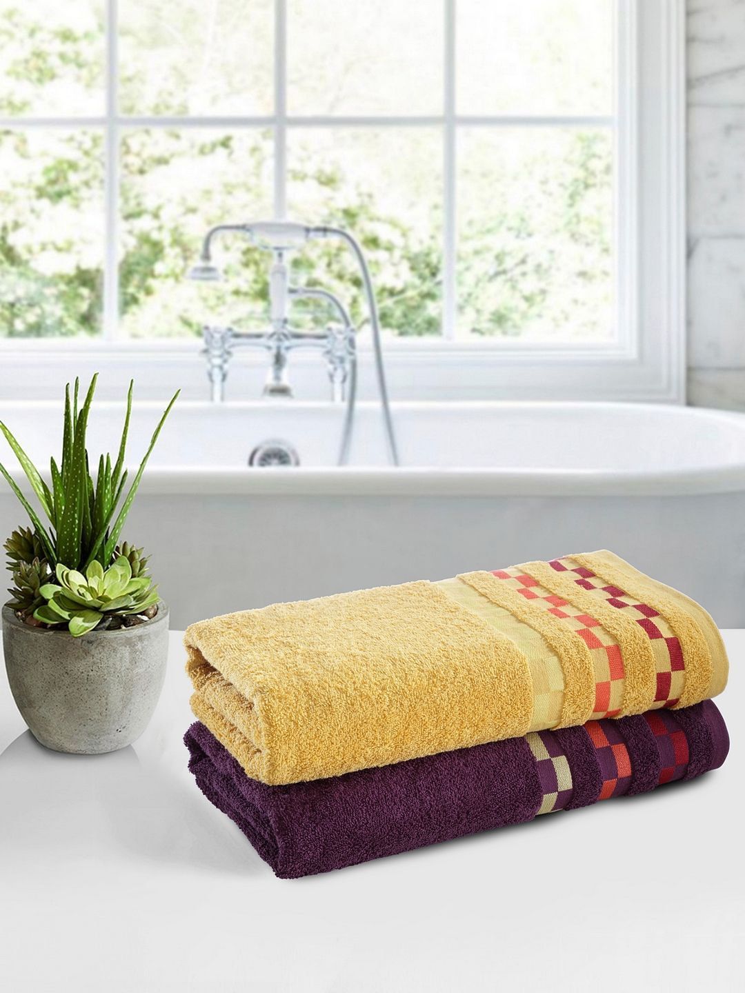 BIANCA Unisex Yellow & Purple Set of 2 Solid 450 GSM Bath Towels Price in India