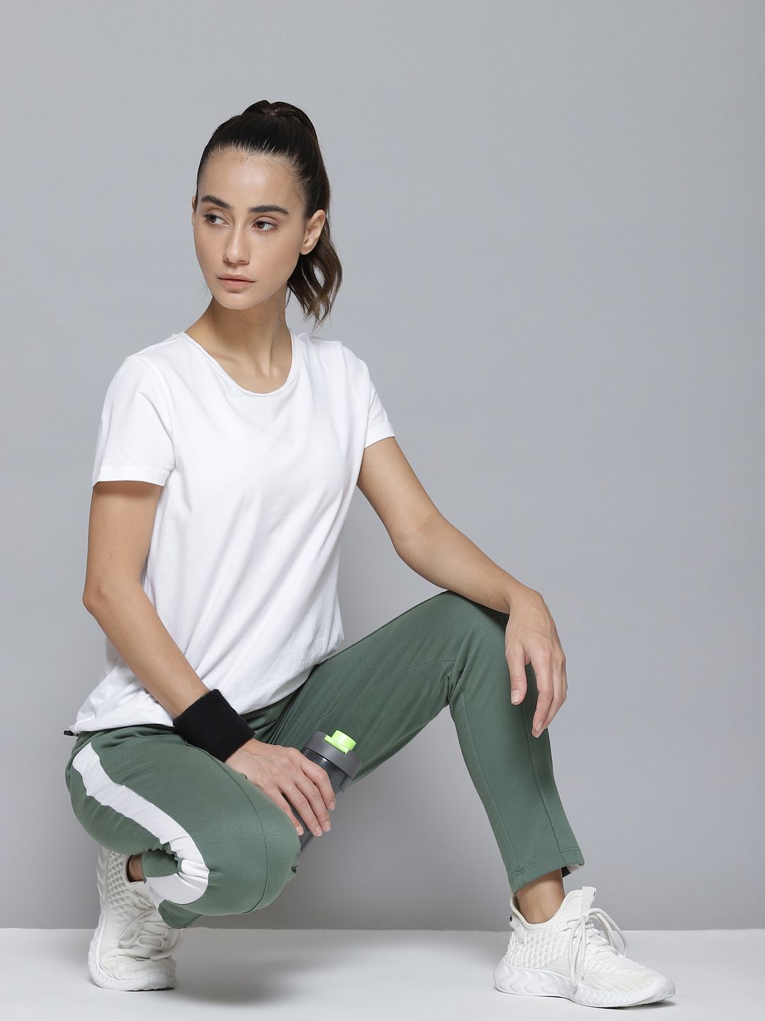 Alcis Women Green & White Striped Track Pants Price in India