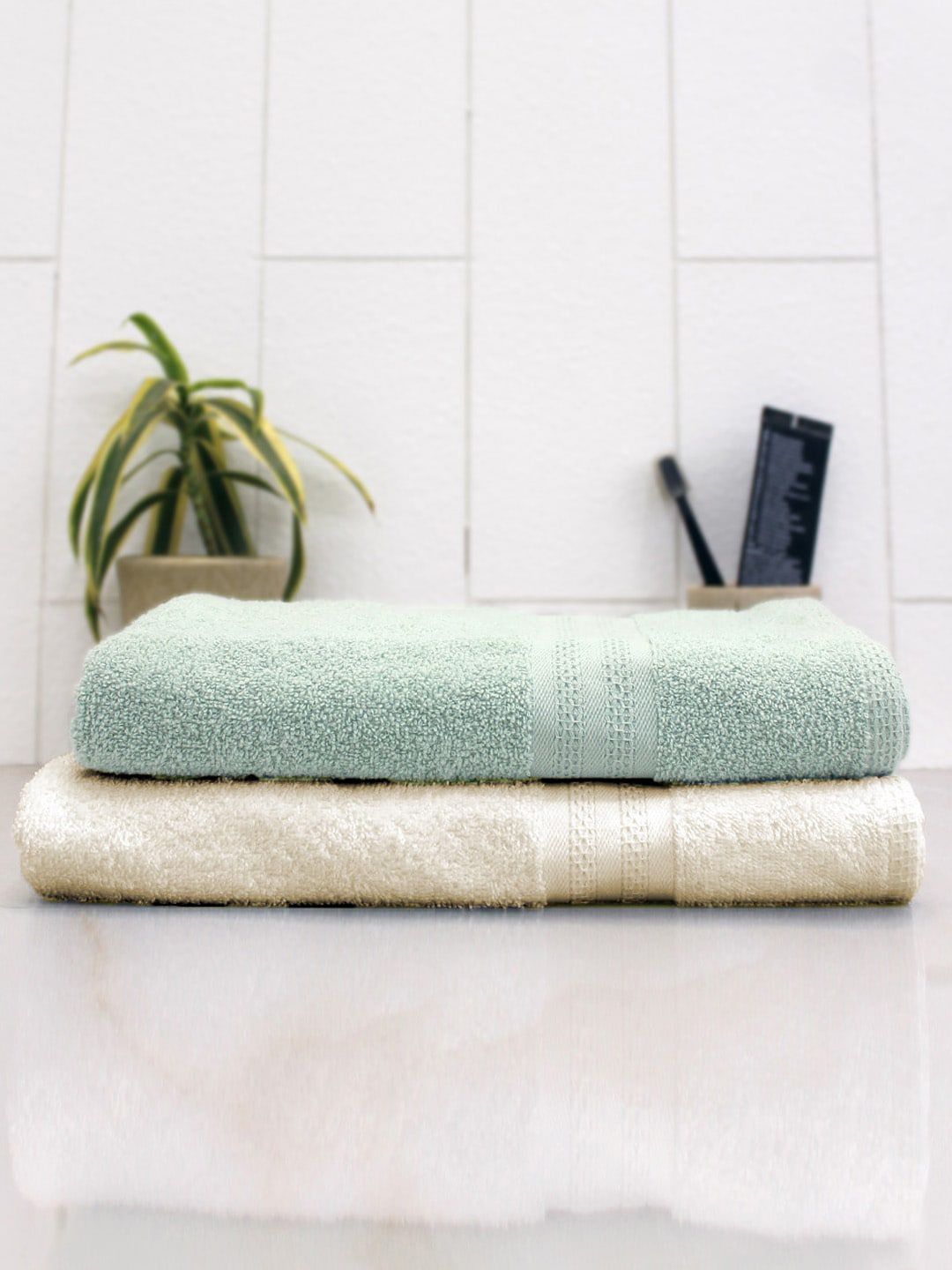AVI Living Set Of 2 Cream-Coloured & Sea Green Solid 400 GSM Quick-Dry Anti-Microbial Bath Towels Price in India
