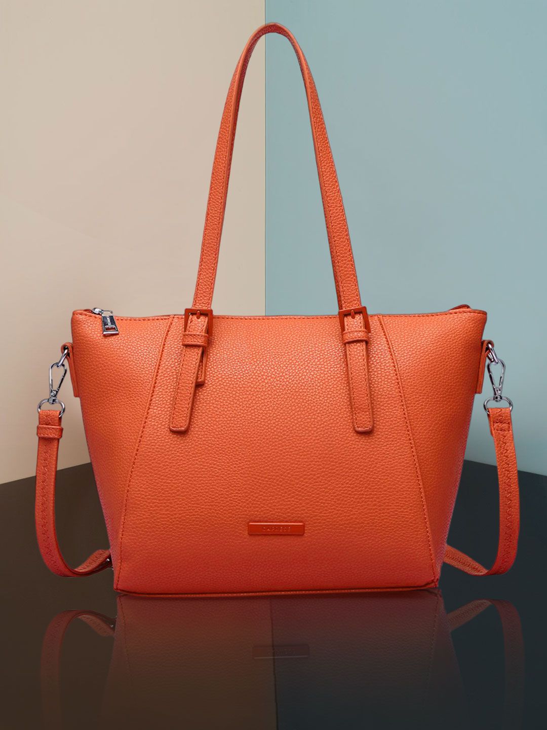 Caprese Coral Orange PU Structured Sling Bag Price in India