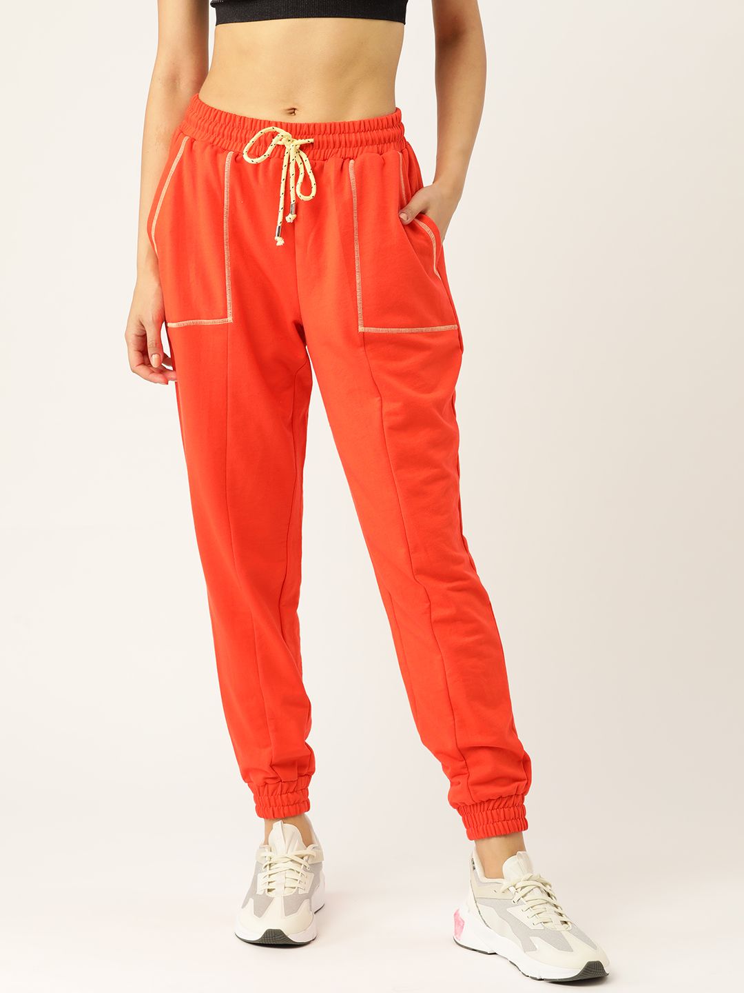 DressBerry Women Orange Solid Joggers Price in India