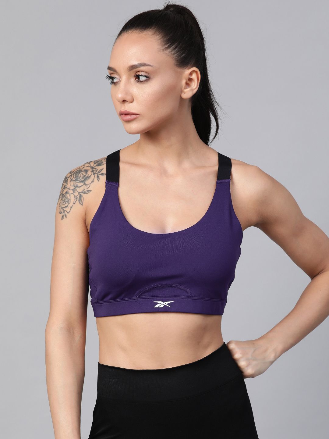 Reebok Women Purple Solid Training Essentials Sports Bra H21599 Price in India