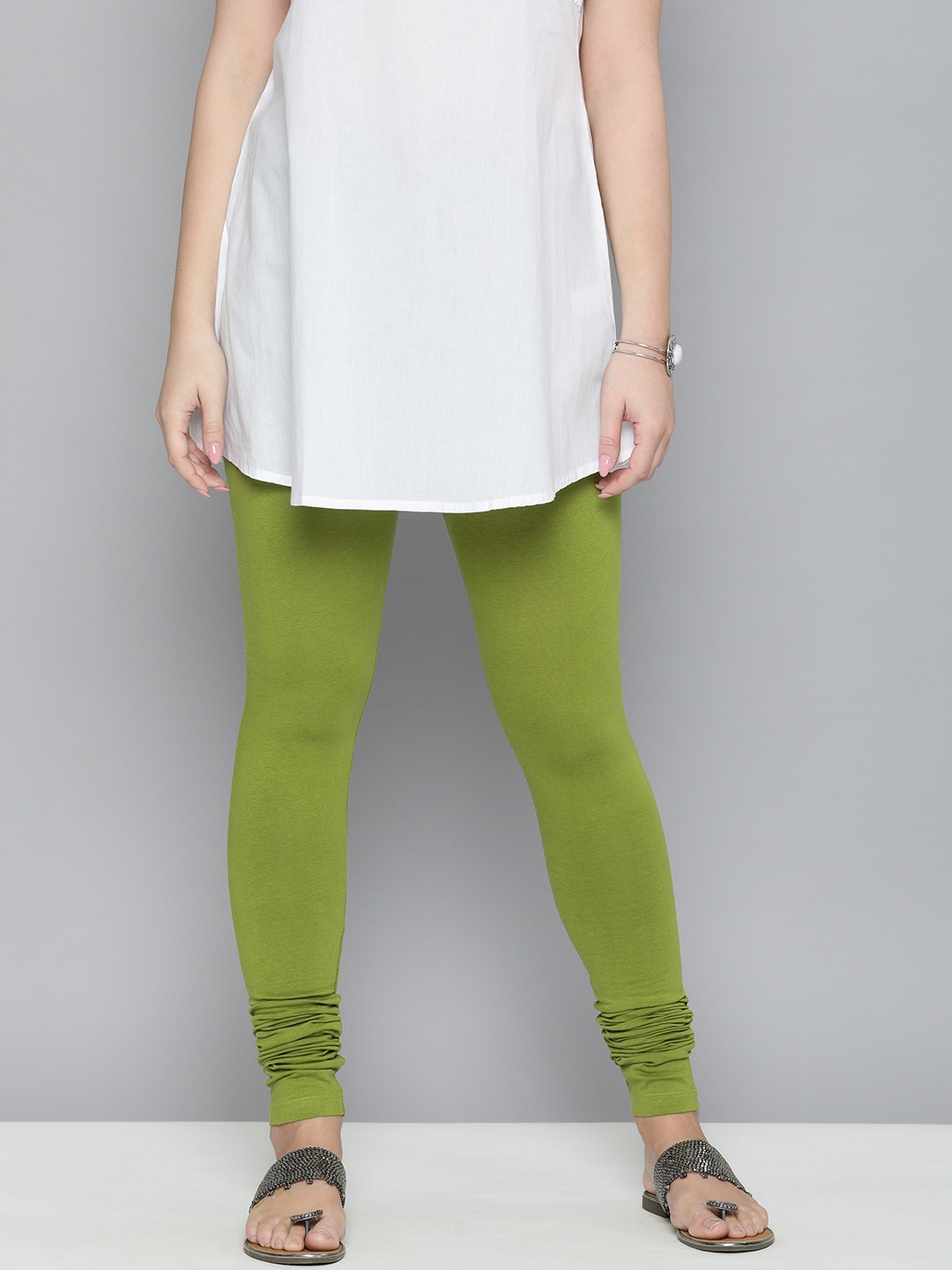 HERE&NOW Women Lime Green Solid Churidar Length Leggings Price in India