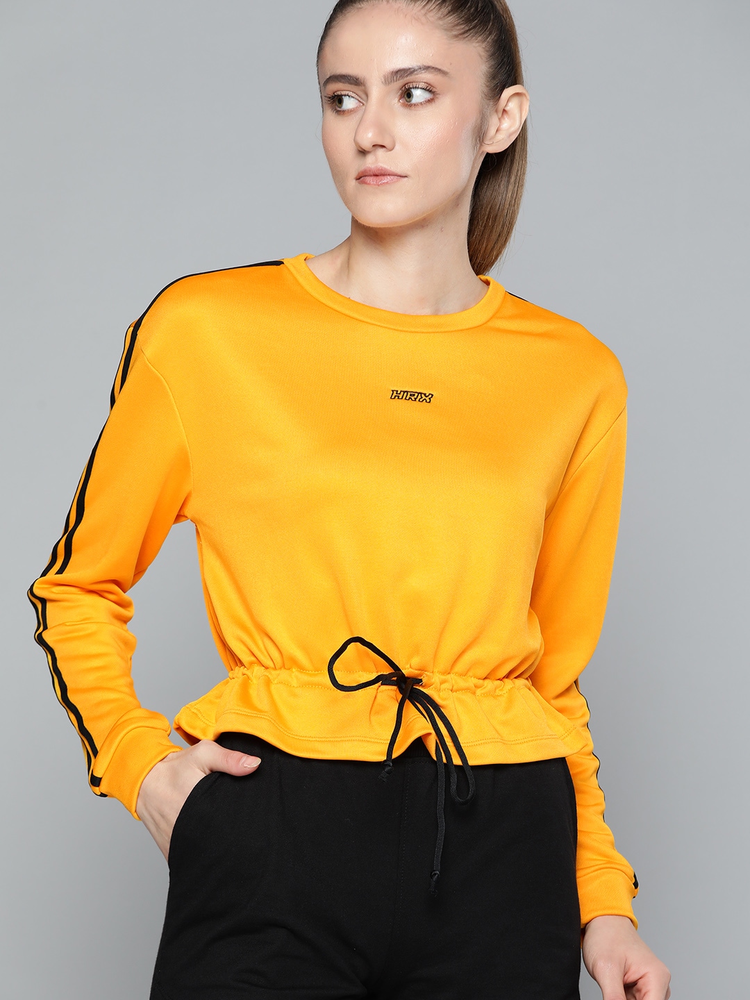 HRX By Hrithik Roshan Lifestyle Women Electric Kumquat Rapid-Dry Solid Sweatshirts Price in India