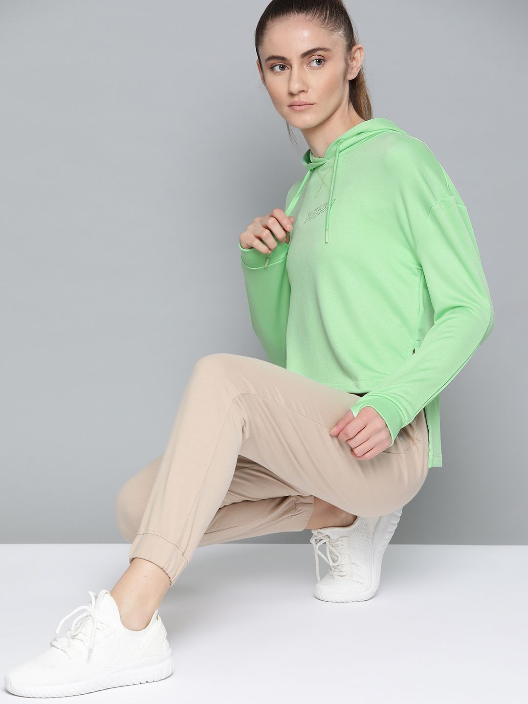 HRX By Hrithik Roshan Lifestyle Women Neo Mint Rapid-Dry Solid Sweatshirt Price in India