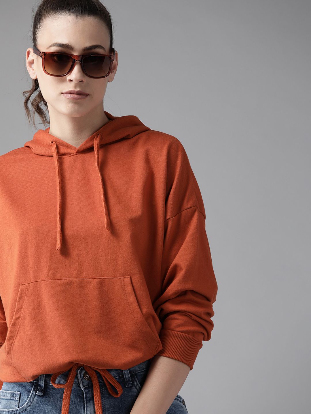 Roadster Women Rust Orange Solid Hooded Sweatshirt Price in India