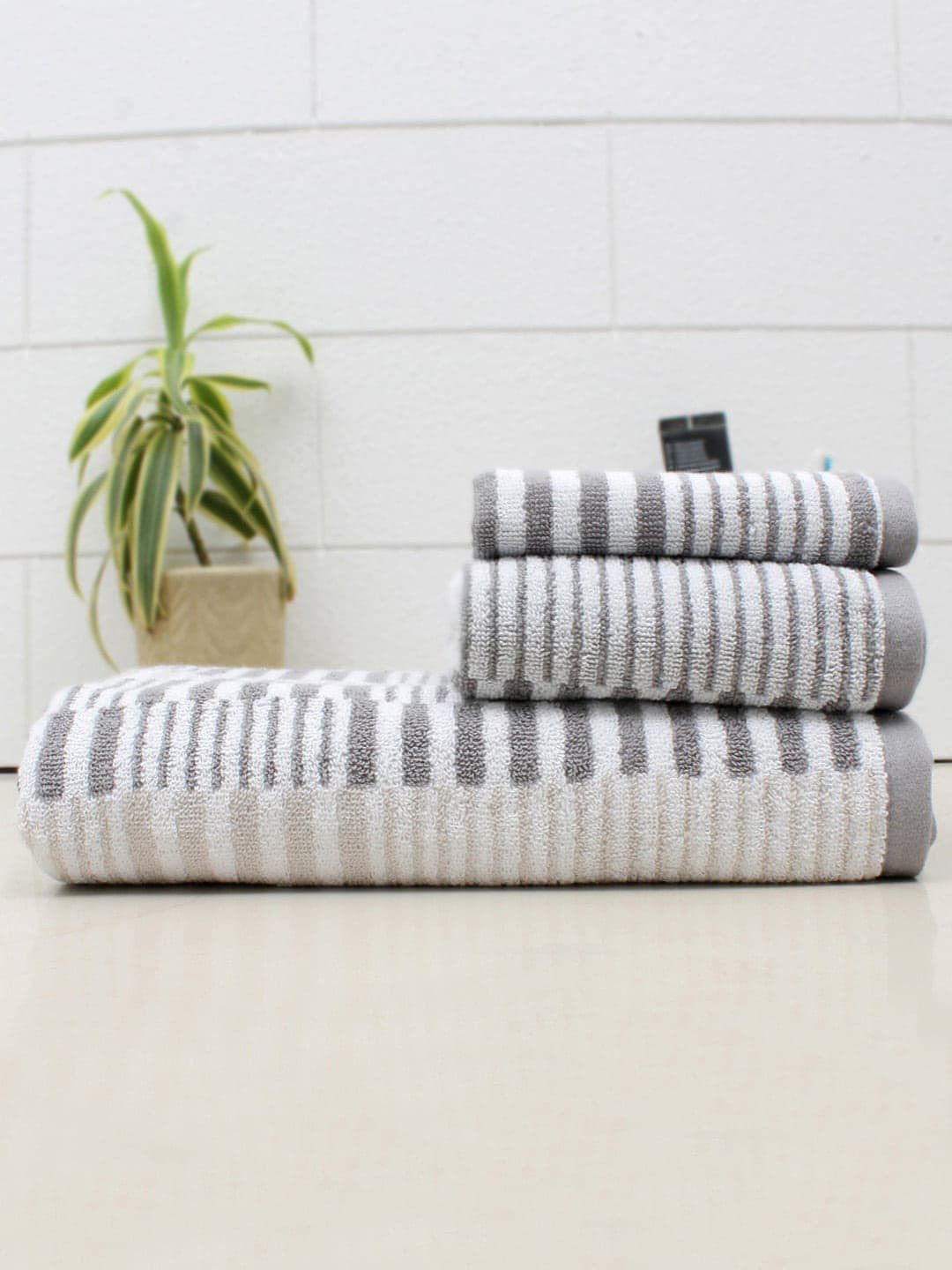 AVI Living Unisex Grey & White Self Design 550 GSM Askew Cotton Towels Price in India