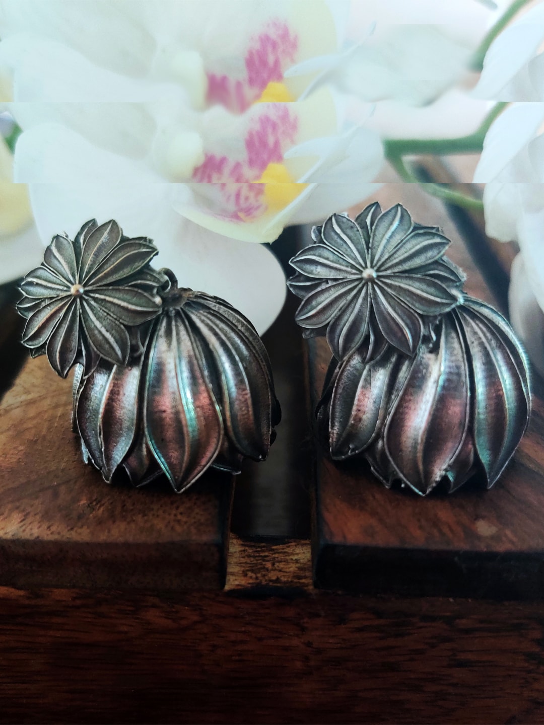 Binnis Wardrobe Silver-Toned Floral Jhumkas Earrings Price in India