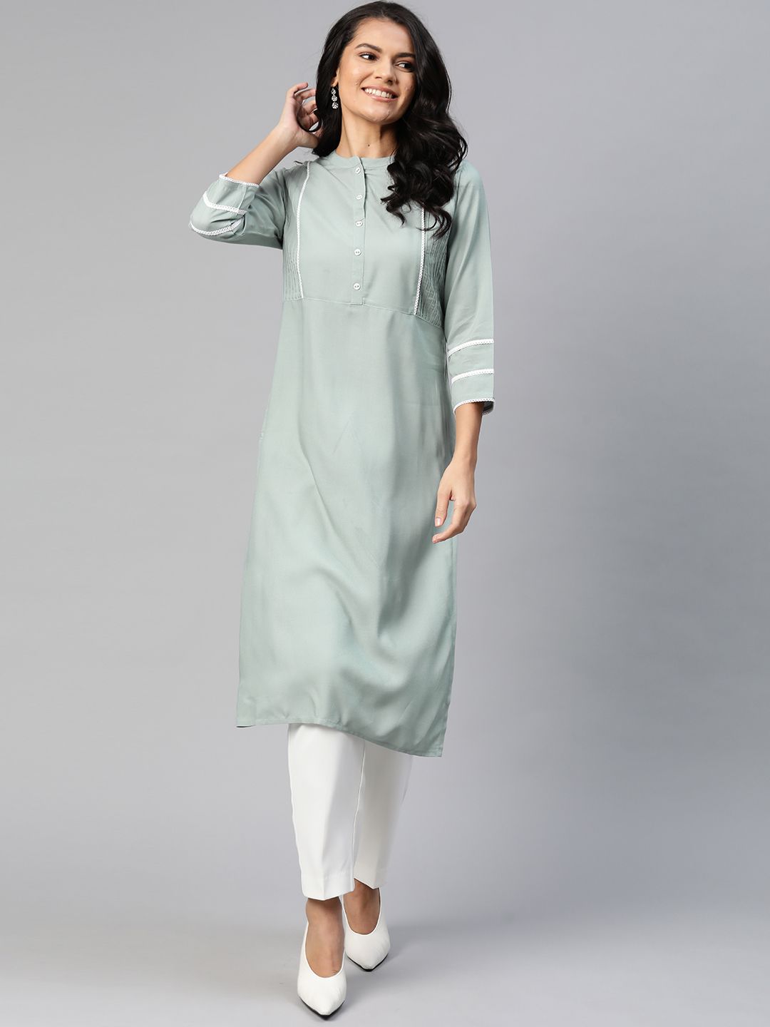 HERE&NOW Women Solid Green Pintuck Pleated Straight Kurta Price in India