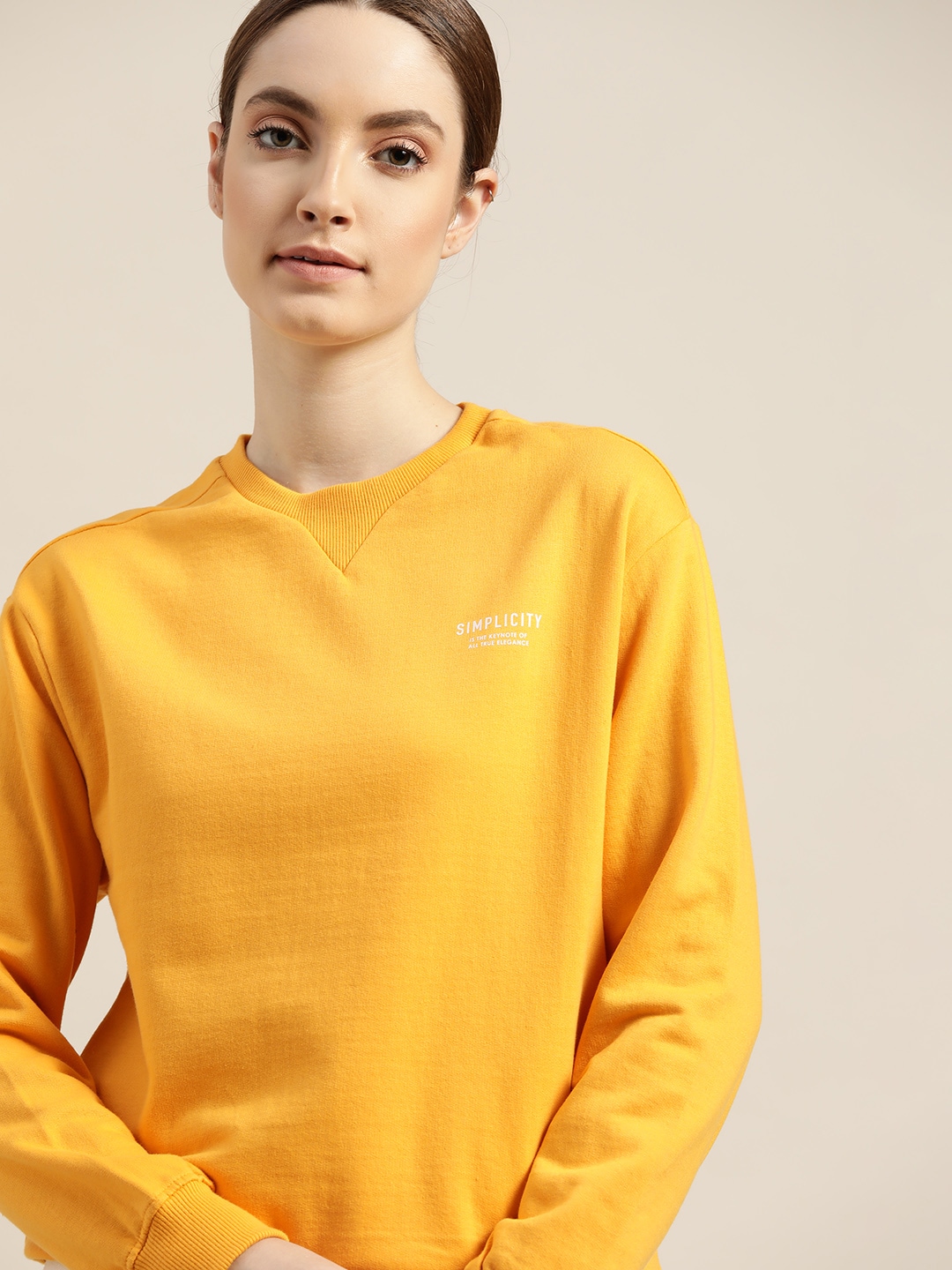 ether Women Mustard Yellow Solid Sweatshirt Price in India