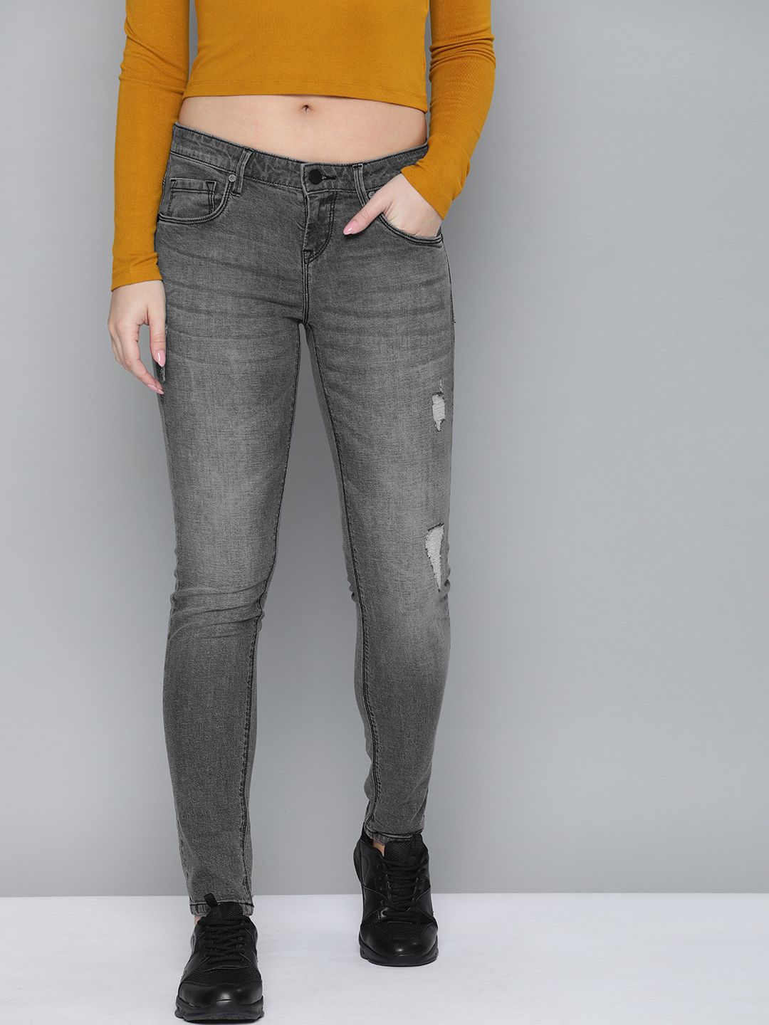 HERE&NOW Women Grey Skinny Fit Mildly Distressed Light Fade Stretchable Jeans Price in India