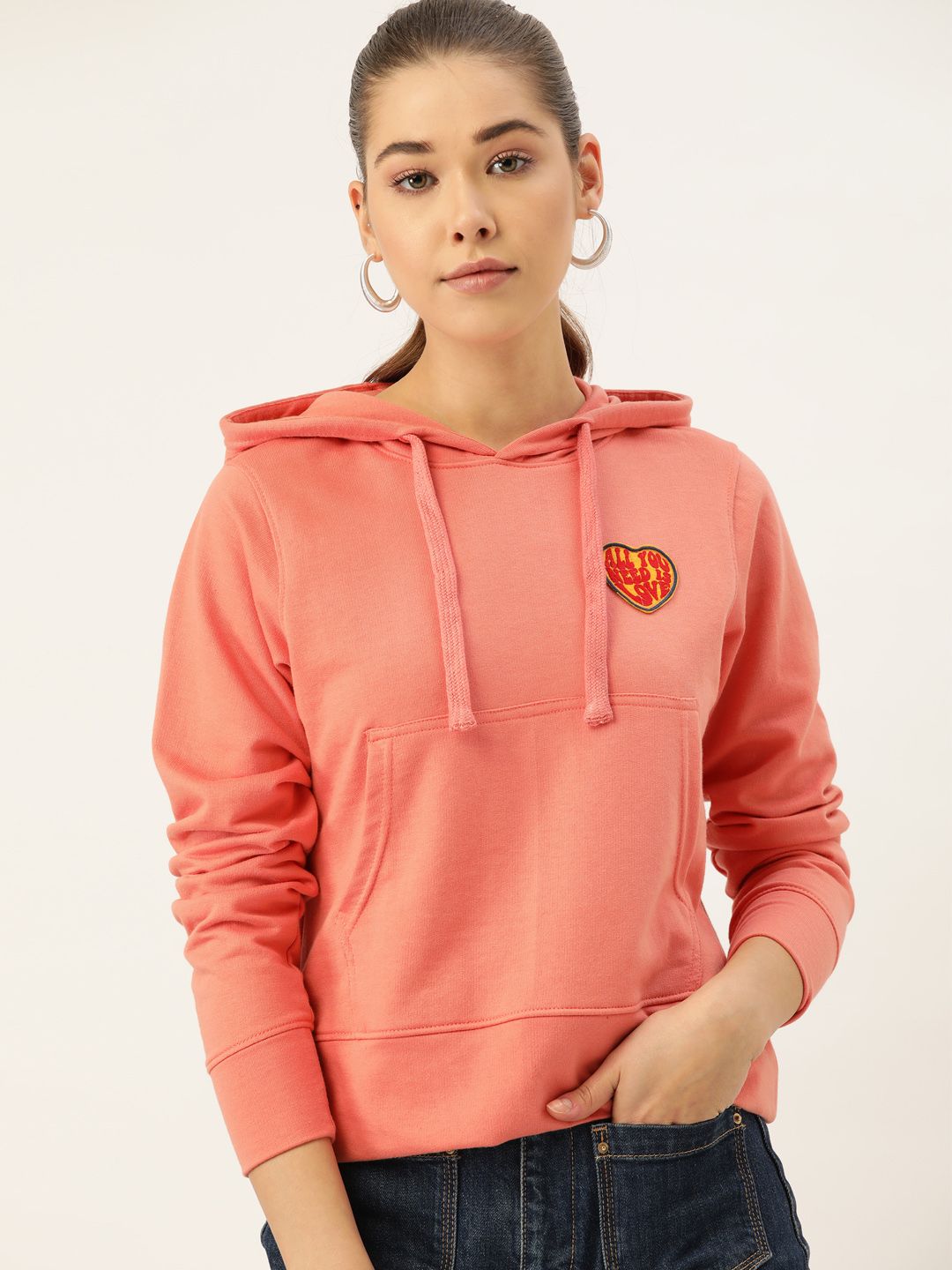 DressBerry Women Peach-Colored Solid Hooded Sweatshirt Price in India