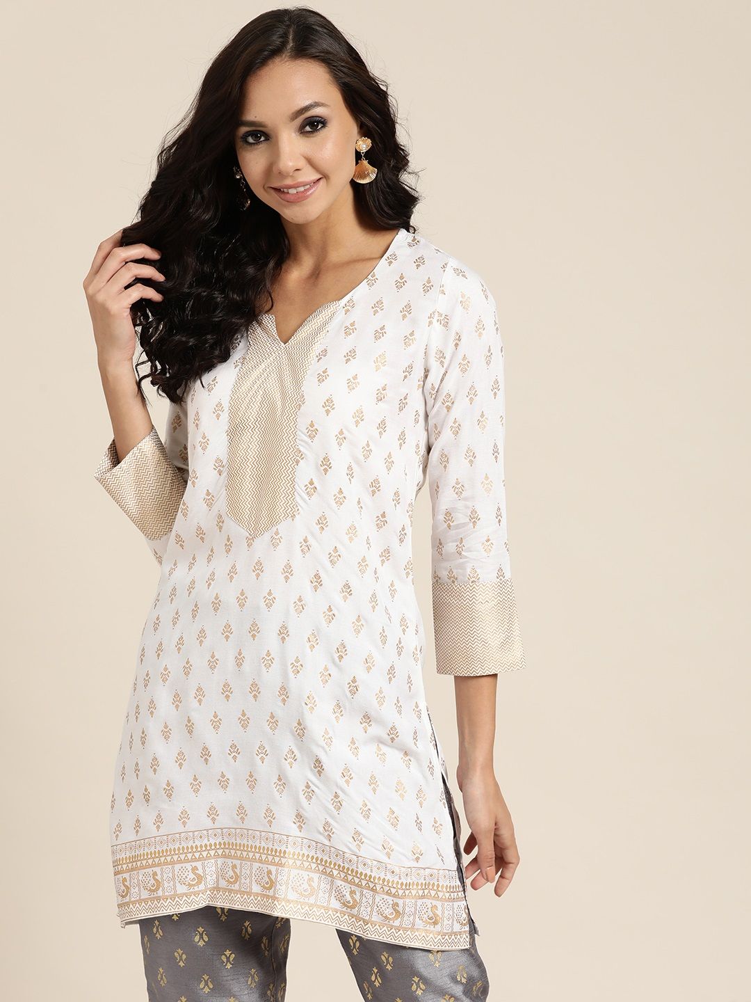 Shae by SASSAFRAS White & Golden Printed Liva Tunic Price in India